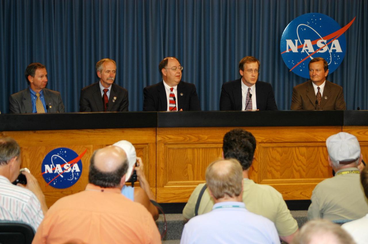 KENNEDY SPACE CENTER, FLA. -  At a post-launch briefing, Shuttle Program Manager Wayne Hale, center, briefs the media about the successful launch of Space Shuttle Discovery on mission STS-121.  Seated with him are, left to right, NASA Administrator Mike Griffin, NASA Associate Administrator for Space Operations Mission Bill Gerstenmaier, Chief of the Mission Management Team John Shannon, and Shuttle Launch Director Mike Leinbach.  Liftoff of Discovery was on time at 2:30 p.m. EDT.