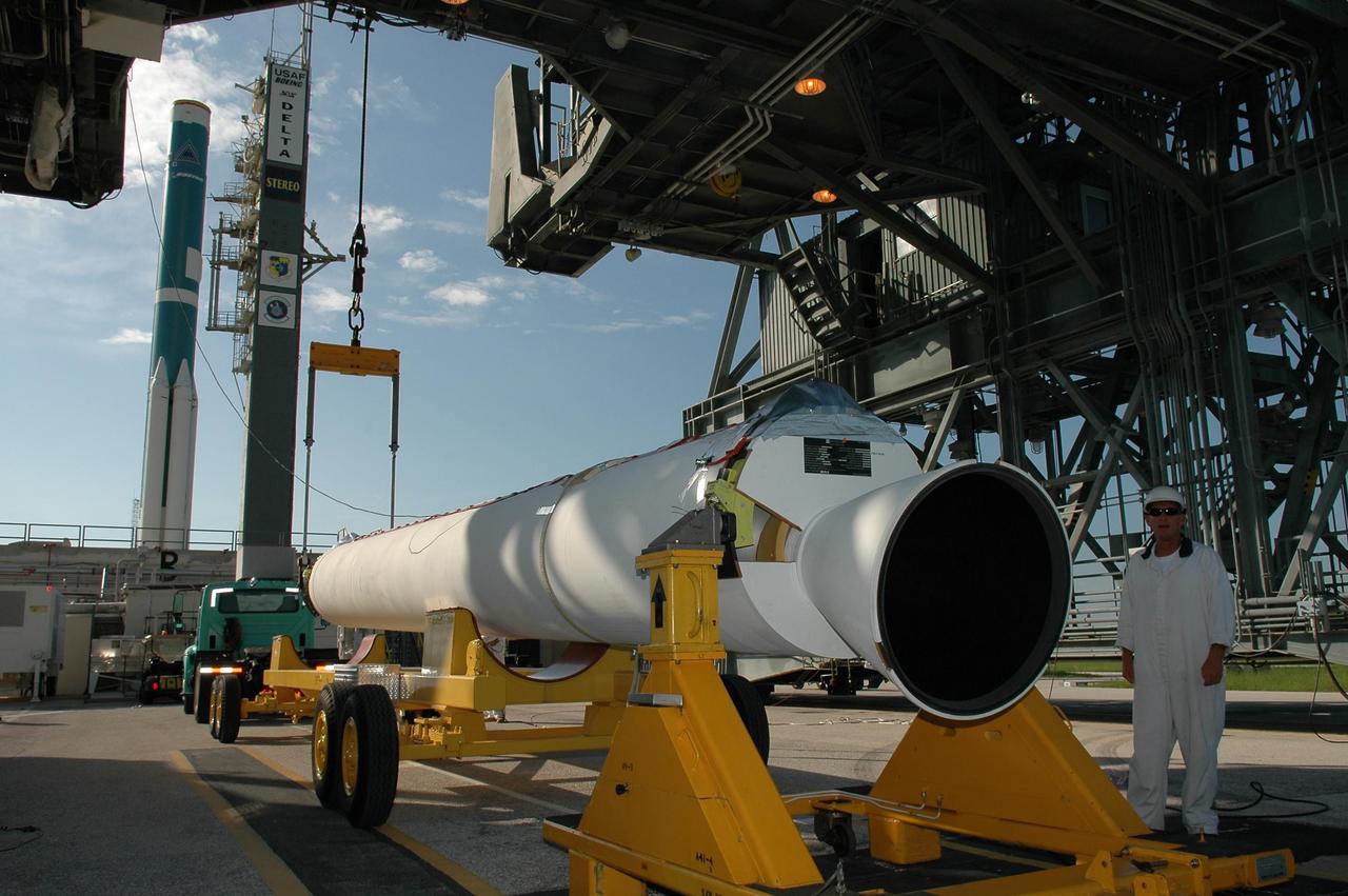 KENNEDY SPACE CENTER, FLA. - A solid rocket booster arrives on Launch Pad 17-B at Cape Canaveral Air Force Station in Florida. The booster will be lifted into the mobile service tower and mated with the Boeing Delta II rocket already in place. The Delta rocket is the launch vehicle for NASA's Solar Terrestrial Relations Observatory (STEREO). Preparations are under way for a liftoff no earlier than Aug. 1. STEREO consists of two spacecraft whose mission is the first to take measurements of the sun and solar wind in 3-D. This new view will improve our understanding of space weather and its impact on the Earth. Photo credit: NASA/Kim Shiflett