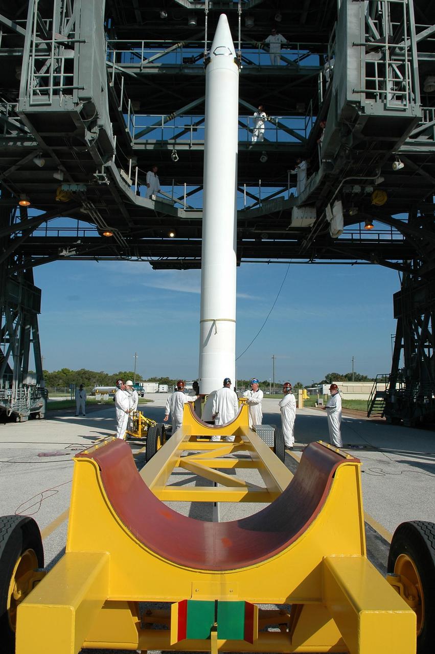 KENNEDY SPACE CENTER, FLA. - A solid rocket booster, raised to a vertical position on Launch Pad 17-B at Cape Canaveral Air Force Station in Florida, is ready to be lifted into the mobile service tower and mated with the Boeing Delta II rocket already in place. The Delta rocket is the launch vehicle for NASA's Solar Terrestrial Relations Observatory (STEREO). Preparations are under way for a liftoff no earlier than Aug. 1. STEREO consists of two spacecraft whose mission is the first to take measurements of the sun and solar wind in 3-D. This new view will improve our understanding of space weather and its impact on the Earth. Photo credit: NASA/Kim Shiflett