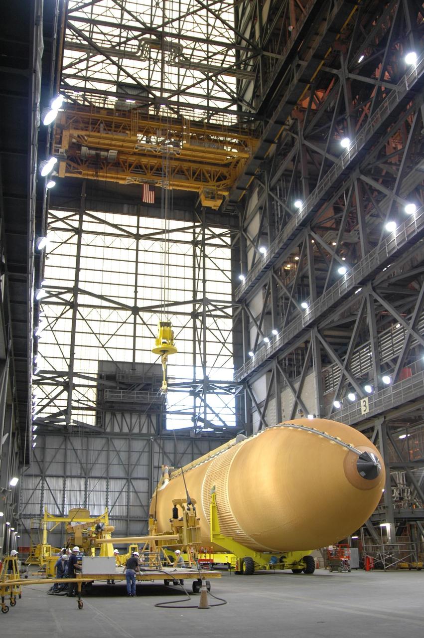 KENNEDY SPACE CENTER, FLA. -   External tank No. 118 waits in the Vehicle Assembly Building for a crane to be attached that will raise it to vertical and lifted into high bay 3 for mating with solid rocket boosters stacked there. The tank is designated to fly on mission STS-115 with Atlantis.  It will fly with many major safety changes, including the removal of the protuberance air load ramps. The mission will deliver the second port truss segment, the P3/P4 Truss, to attach to the first port truss segment, the P1 Truss, as well as deploy solar array set 2A and 4A.  Launch of Space Shuttle Atlantis is scheduled for late August. Photo credit: NASA/Jim Grossmann