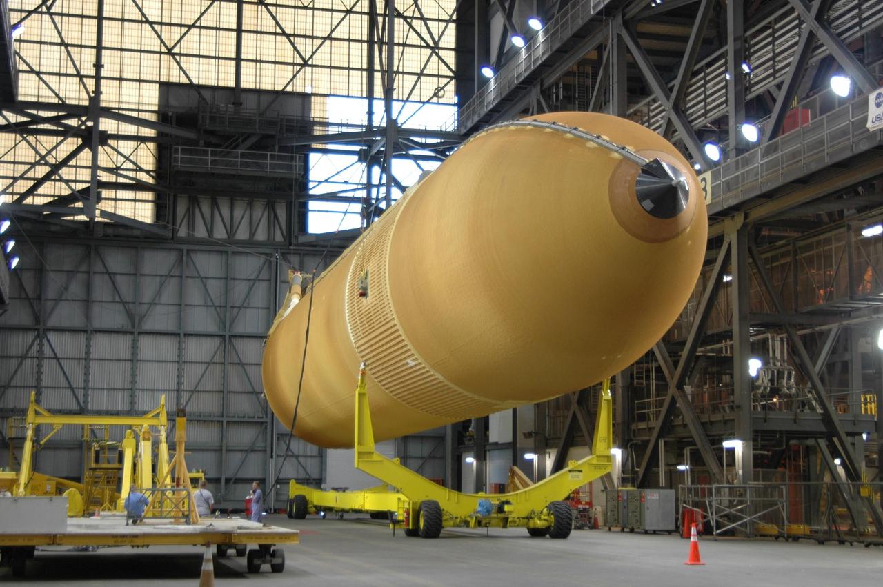 KENNEDY SPACE CENTER, FLA. -   In the Vehicle Assembly Building, external tank No. 118 is lifted off its transporter before being raised to vertical and into high bay 3 for mating with solid rocket boosters stacked there. The tank is designated to fly on mission STS-115 with Atlantis.  It will fly with many major safety changes, including the removal of the protuberance air load ramps. The mission will deliver the second port truss segment, the P3/P4 Truss, to attach to the first port truss segment, the P1 Truss, as well as deploy solar array set 2A and 4A.  Launch of Space Shuttle Atlantis is scheduled for late August. Photo credit: NASA/Jim Grossmann
