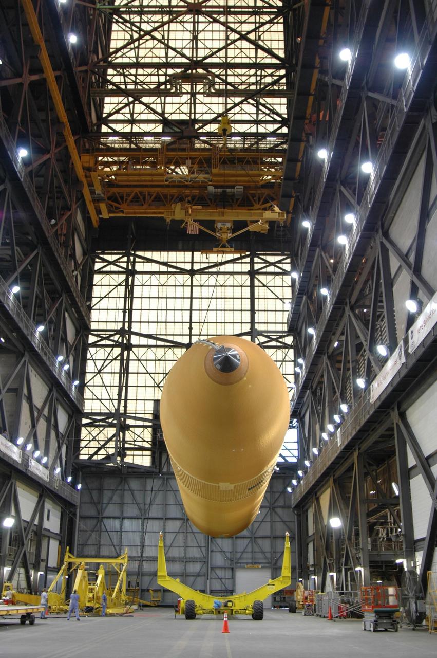 KENNEDY SPACE CENTER, FLA. -   In the Vehicle Assembly Building, external tank No. 118 is lifted off its transporter before being raised to vertical and into high bay 3 for mating with solid rocket boosters stacked there.  The tank is designated to fly on mission STS-115 with Atlantis.  It will fly with many major safety changes, including the removal of the protuberance air load ramps. The mission will deliver the second port truss segment, the P3/P4 Truss, to attach to the first port truss segment, the P1 Truss, as well as deploy solar array set 2A and 4A.  Launch of Space Shuttle Atlantis is scheduled for late August. Photo credit: NASA/Jim Grossmann