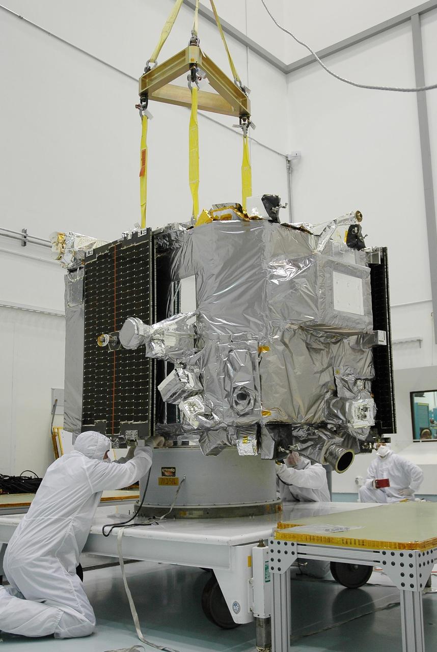 KENNEDY SPACE CENTER, FLA. - In the hazardous processing facility at Astrotech Space Operations in Titusville, Fla., technicians check Observatory A before lifting onto a scale for weight measurements. The observatory is one of two in the STEREO spacecraft and later will be fueled. STEREO stands for Solar Terrestrial Relations Observatory. The STEREO mission is the first to take measurements of the sun and solar wind in 3-dimension. This new view will improve our understanding of space weather and its impact on the Earth. STEREO is expected to lift off aboard a Boeing Delta II rocket no earlier than Aug. 1. Photo credit: NASA/Jack Pfaller