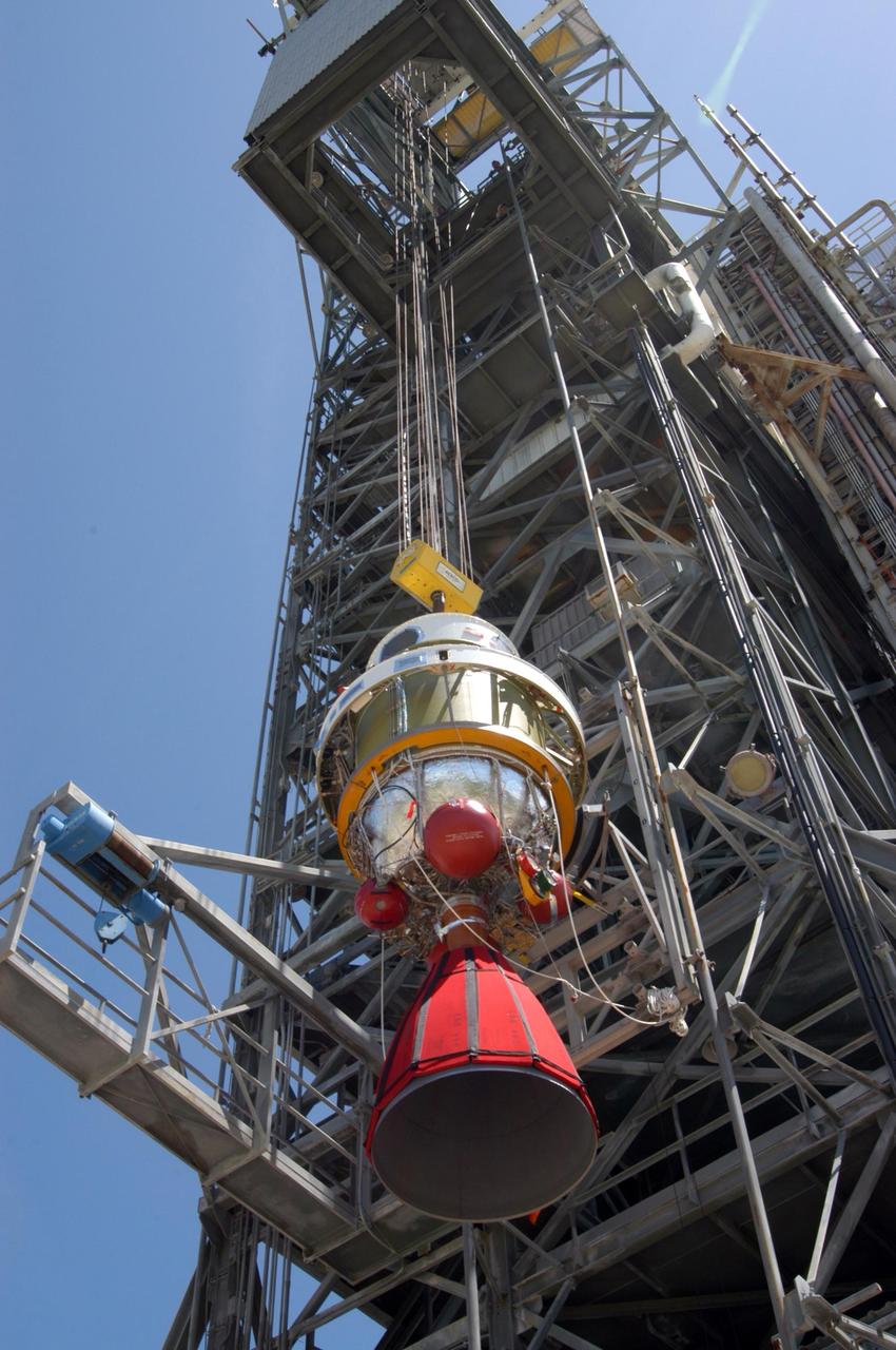KENNEDY SPACE CENTER, FLA. - At Launch Pad 17-B on Cape Canaveral Air Force Station, the Boeing Delta II second stage for the STEREO launch is lifted alongside the mobile service tower. The second stage then will be lifted into the mobile service tower and mated with first stage already in place. STEREO stands for Solar Terrestrial Relations Observatory and comprises two spacecraft. The STEREO mission is the first to take measurements of the sun and solar wind in 3-dimension. This new view will improve our understanding of space weather and its impact on the Earth. STEREO is expected to lift off in August 2006. Photo credit: NASA/George Shelton