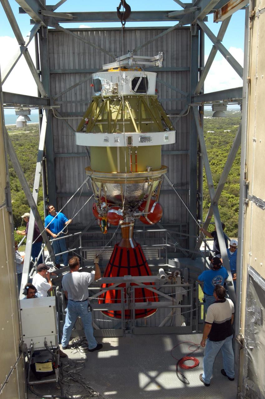 KENNEDY SPACE CENTER, FLA. - At Launch Pad 17-B on Cape Canaveral Air Force Station, the Boeing Delta II second stage for the STEREO launch is moved inside the mobile service tower. The second stage then will be lifted into the mobile service tower and mated with first stage already in place. STEREO stands for Solar Terrestrial Relations Observatory and comprises two spacecraft. The STEREO mission is the first to take measurements of the sun and solar wind in 3-dimension. This new view will improve our understanding of space weather and its impact on the Earth. STEREO is expected to lift off in August 2006. Photo credit: NASA/George Shelton