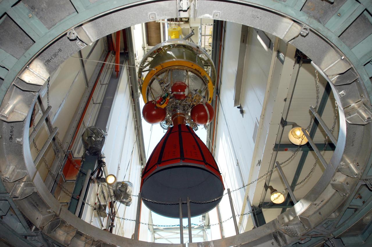 KENNEDY SPACE CENTER, FLA. - Inside the mobile service tower on Launch Pad 17-B on Cape Canaveral Air Force Station, the Boeing Delta II second stage for the STEREO launch is lowered toward the first stage. The two stages will be mated. STEREO stands for Solar Terrestrial Relations Observatory and comprises two spacecraft. The STEREO mission is the first to take measurements of the sun and solar wind in 3-dimension. This new view will improve our understanding of space weather and its impact on the Earth. STEREO is expected to lift off in August 2006. Photo credit: NASA/George Shelton