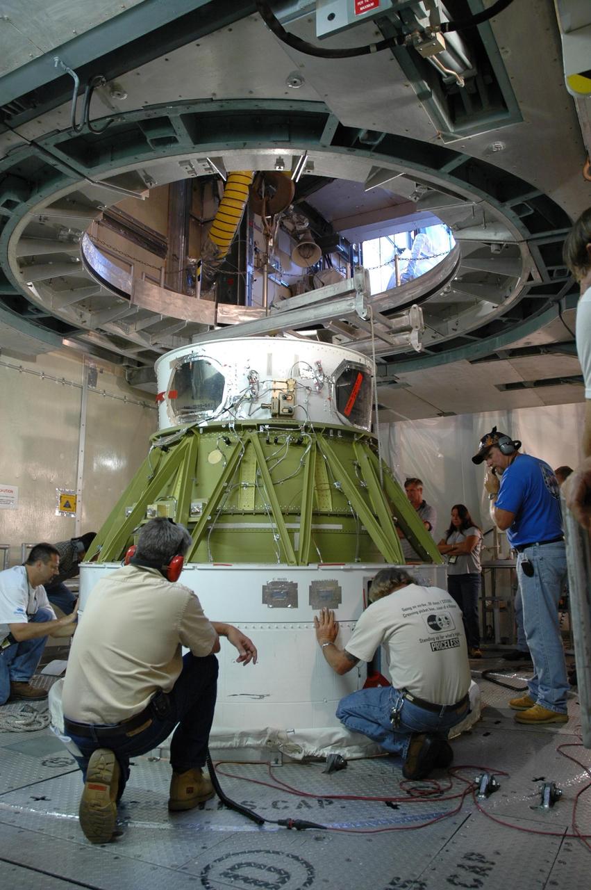 KENNEDY SPACE CENTER, FLA. - Inside the mobile service tower on Launch Pad 17-B at Cape Canaveral Air Force Station in Florida, workers get ready to destack the second stage segment from the Delta II rocket below. At the Boeing plant in Alabama, a leak was observed in the second-stage oxidizer tank for another Delta II that had been scheduled to launch in November; therefore, all identical tanks scheduled for launch in the near future are being checked. The second stage for the Delta II that will launch STEREO cannot be effectively tested while atop the first stage at Pad 17-B. STEREO stands for Solar Terrestrial Relations Observatory and comprises two spacecraft. The STEREO mission is the first to take measurements of the sun and solar wind in 3-dimension. This new view will improve our understanding of space weather and its impact on the Earth. STEREO is expected to lift off in late August 2006. Photo credit: NASA/Jim Grossmann