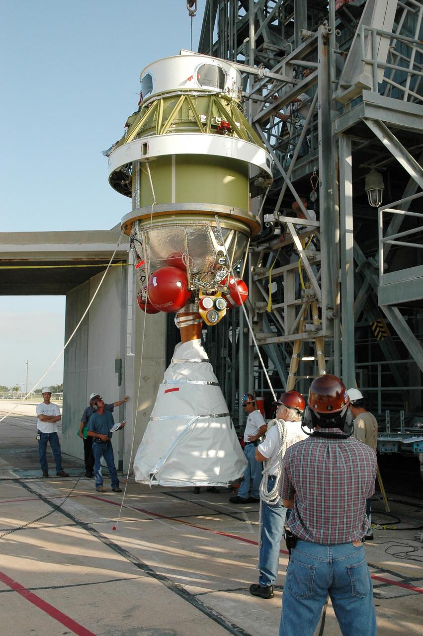 KENNEDY SPACE CENTER, FLA. - At Launch Complex 17 on Cape Canaveral Air Force Station, the now-vertical second stage of the Boeing Delta II launch vehicle for the STEREO spacecraft is ready for lifting into the mobile service tower. There it will be remated with the Delta first stage. The stage has been returned to the pad after being tested for leaks in the High-Pressure Test Facility; no leak was observed. STEREO stands for Solar Terrestrial Relations Observatory and comprises two spacecraft. The STEREO mission is the first to take measurements of the sun and solar wind in 3-dimension. This new view will improve our understanding of space weather and its impact on the Earth. STEREO is expected to lift off on Aug. 31. Photo credit: NASA/Dimitri Gerondidakis