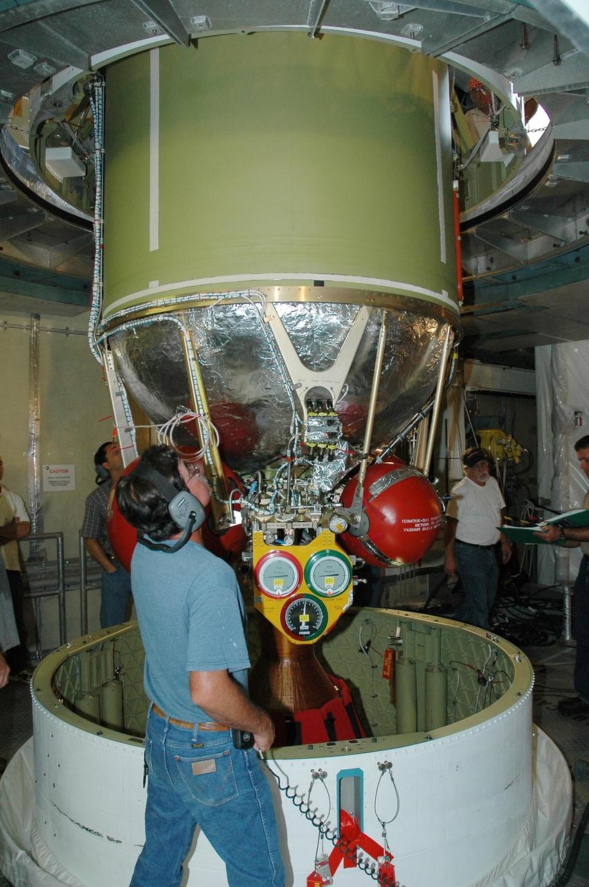 KENNEDY SPACE CENTER, FLA. - Inside the mobile service tower on Launch Pad 17-B at Cape Canaveral Air Force Station, the second stage of the Boeing Delta II launch vehicle for the STEREO spacecraft is lowered toward the Delta first stage below for remating. The second stage has been returned to the pad after being tested for leaks in the High-Pressure Test Facility; no leak was observed. STEREO stands for Solar Terrestrial Relations Observatory and comprises two spacecraft. The STEREO mission is the first to take measurements of the sun and solar wind in 3-dimension. This new view will improve our understanding of space weather and its impact on the Earth. STEREO is expected to lift off on Aug. 31. Photo credit: NASA/Dimitri Gerondidakis