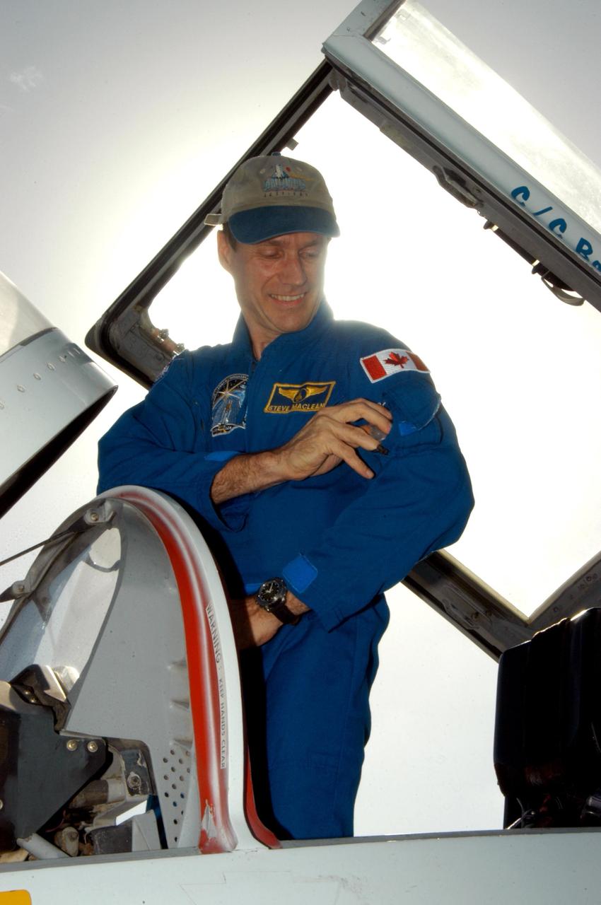 KENNEDY SPACE CENTER, FLA. - STS-115 Mission Specialist arrives at KSC's Shuttle Landing Facility aboard a T-38 jet aircraft. The STS-115 crew has flown to NASA's Kennedy Space Center to take part in Terminal Countdown Demonstration Test activities. The TCDT is a pre-launch preparation that includes practicing emergency egress from the pad, driving an M-113 armored personnel carrier, and simulating the launch countdown. Launch of STS-115 is currently scheduled for Aug. 27. Photo credit: NASA/George Shelton