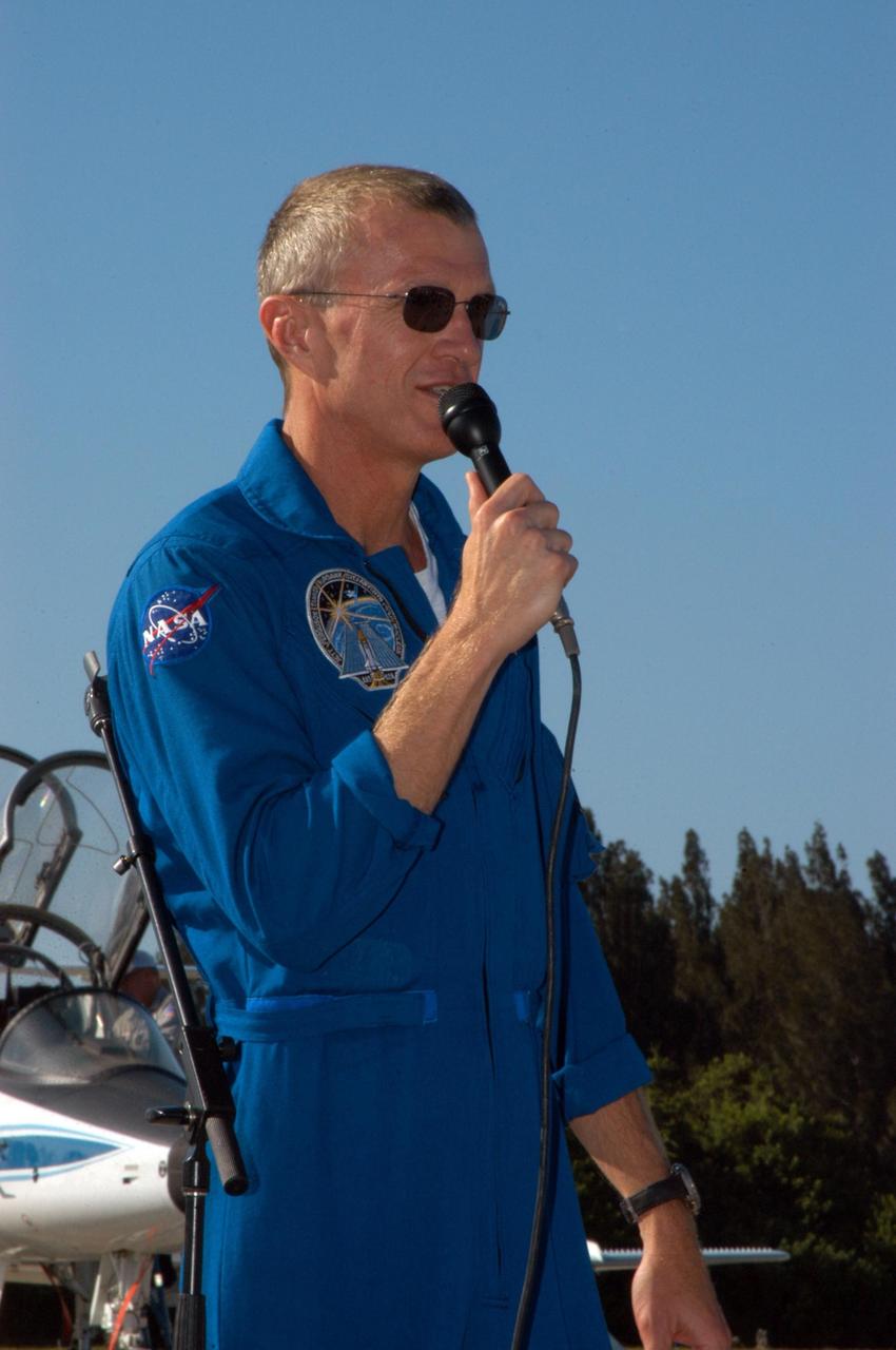 KENNEDY SPACE CENTER, FLA. - STS-115 Commander Brent Jett introduces his crew to waiting media at KSC's Shuttle Landing Facility after their arrival from Houston. The STS-115 crew has flown to NASA's Kennedy Space Center to take part in Terminal Countdown Demonstration Test activities. The TCDT is a pre-launch preparation that includes practicing emergency egress from the pad, driving an M-113 armored personnel carrier, and simulating the launch countdown. Launch of STS-115 is currently scheduled for Aug. 27. Photo credit: NASA/George Shelton