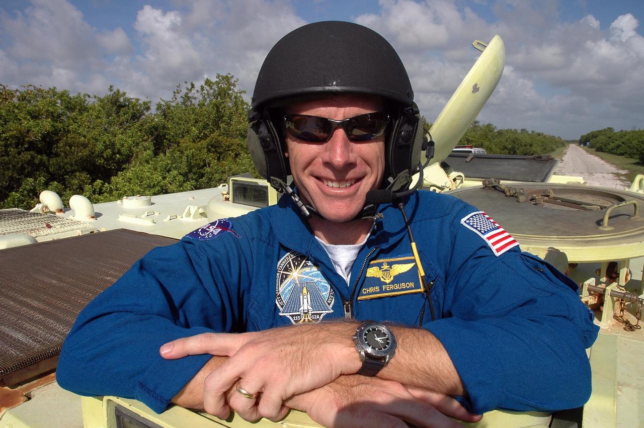 KENNEDY SPACE CENTER, FLA. -  STS-115 Pilot Christopher Ferguson is ready to practice driving the M-113 armored personnel carrier.  The STS-115 crew are at NASA's Kennedy Space Center for Terminal Countdown Demonstration Test activities such as the M-113 training.  They will also practice emergency egress from the launch pad and take part in a simulated launch countdown.  Liftoff of mission STS-115 aboard Space Shuttle Atlantis is scheduled in a window beginning Aug. 27.   Photo credit: NASA/Cory Huston