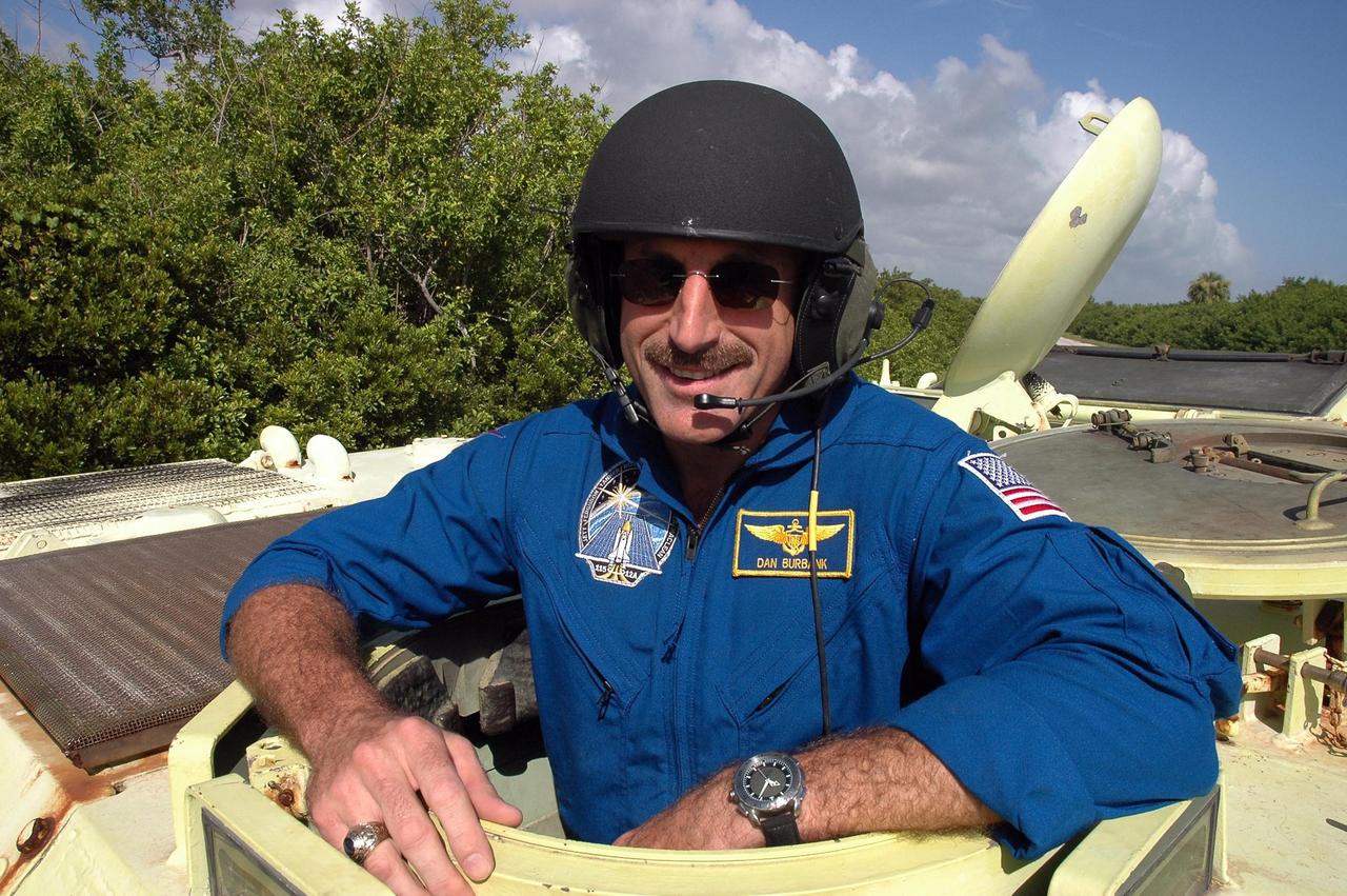 KENNEDY SPACE CENTER, FLA. -  STS-115 Mission Specialist Daniel Burbank is ready to practice driving the M-113 armored personnel carrier. The STS-115 crew are at NASA's Kennedy Space Center for Terminal Countdown Demonstration Test activities such as the M-113 training.  They will also practice emergency egress from the launch pad and take part in a simulated launch countdown.  Liftoff of mission STS-115 aboard Space Shuttle Atlantis is scheduled in a window beginning Aug. 27.   Photo credit: NASA/Cory Huston