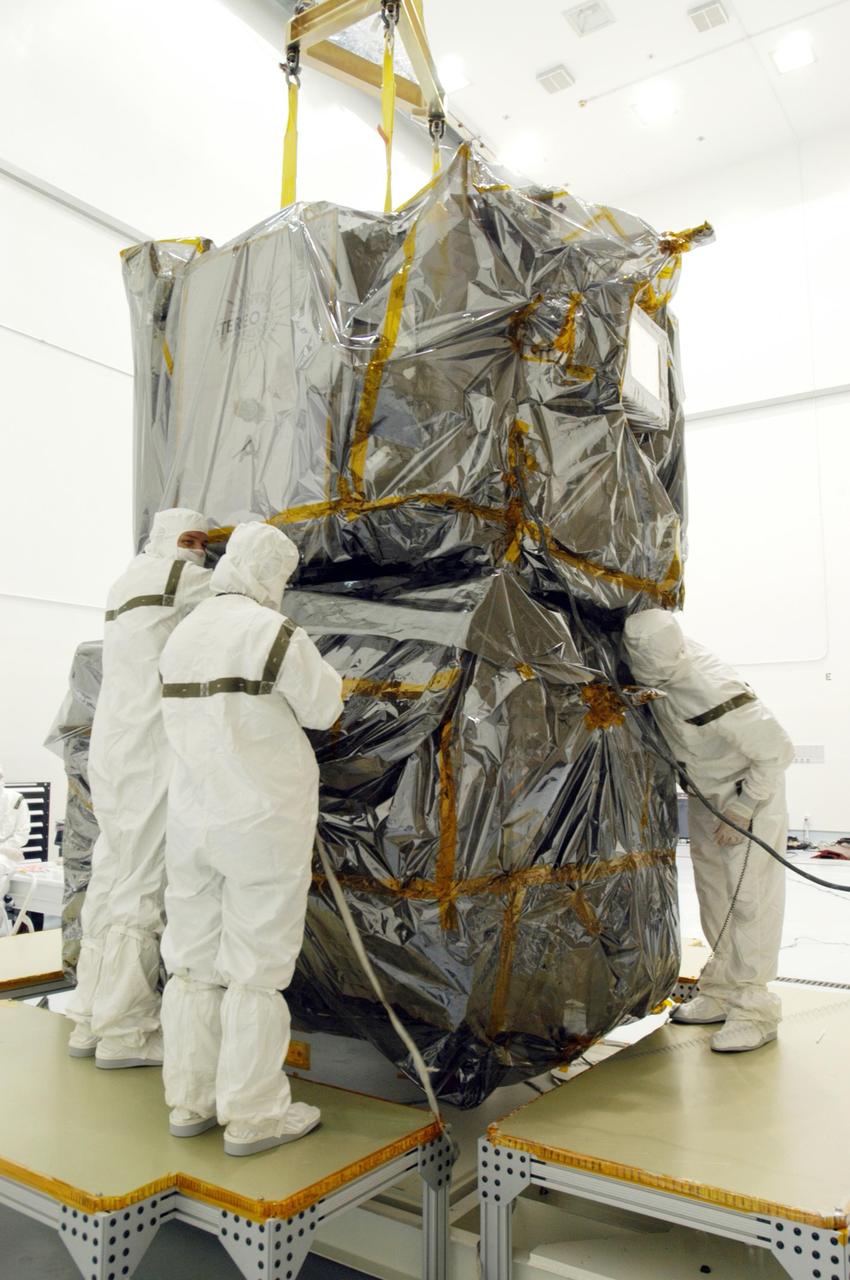 KENNEDY SPACE CENTER, FLA. - At Astrotech Space Operations in Titusville, Fla., workers check the mating of the two STEREO observatories, which is the launch configuration. STEREO, which stands for Solar Terrestrial Relations Observatory, is the first to take measurements of the sun and solar wind in 3-dimension. This new view will improve our understanding of space weather and its impact on the Earth. STEREO is expected to lift off aboard a Boeing Delta II rocket from Launch Pad 17-B at Cape Canaveral Air Force Station on Aug. 31. Photo credit: NASA/George Shelton