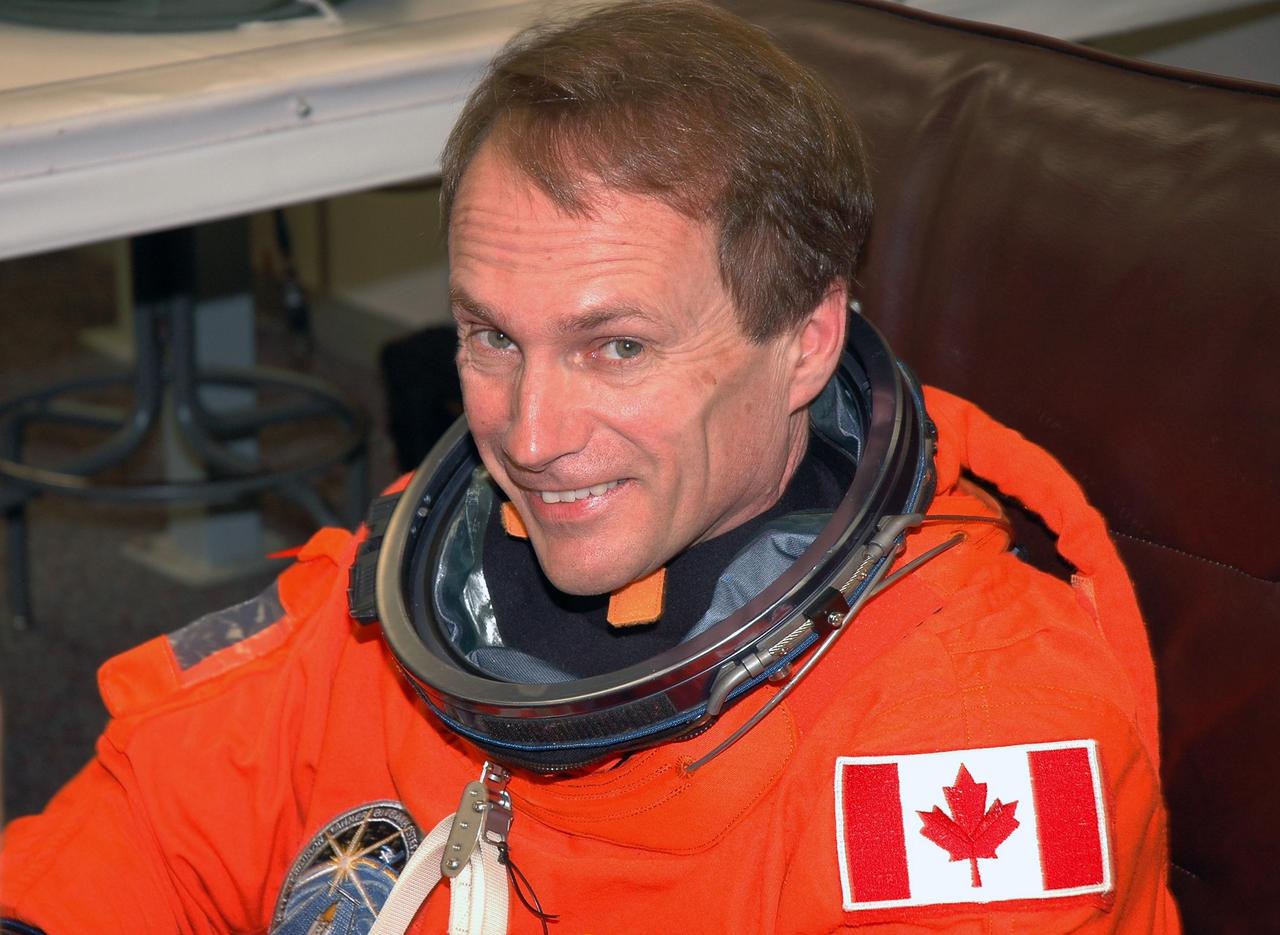 KENNEDY SPACE CENTER, FLA. - The STS-115 crew members are suiting up for their simulated launch countdown. Shown here is Mission Specialist Steven MacLean, who is with the Canadian Space Agency. The mission crew is at KSC for Terminal Countdown Demonstration Test (TCDT) activities that are preparation for launch on Space Shuttle Atlantis, scheduled to take place in a window that opens Aug. 27. The TCDT has included emergency egress training as well as the simulation. During their 11-day mission to the International Space Station, the STS-115 crew will continue construction of the station and attach the payload elements, the Port 3/4 truss segment with its two large solar arrays. Photo credit: NASA/Cory Huston