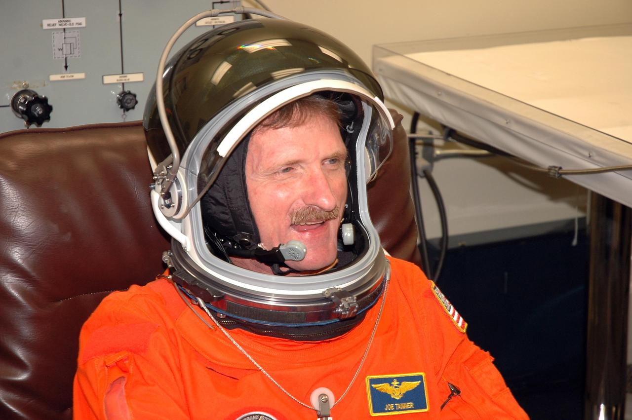 KENNEDY SPACE CENTER, FLA. - The STS-115 crew members are suiting up for their simulated launch countdown. Shown here is Mission Specialist Joseph Tanner. The mission crew is at KSC for Terminal Countdown Demonstration Test (TCDT) activities that are preparation for launch on Space Shuttle Atlantis, scheduled to take place in a window that opens Aug. 27. The TCDT has included emergency egress training as well as the simulation. During their 11-day mission to the International Space Station, the STS-115 crew will continue construction of the station and attach the payload elements, the Port 3/4 truss segment with its two large solar arrays. Photo credit: NASA/Cory Huston