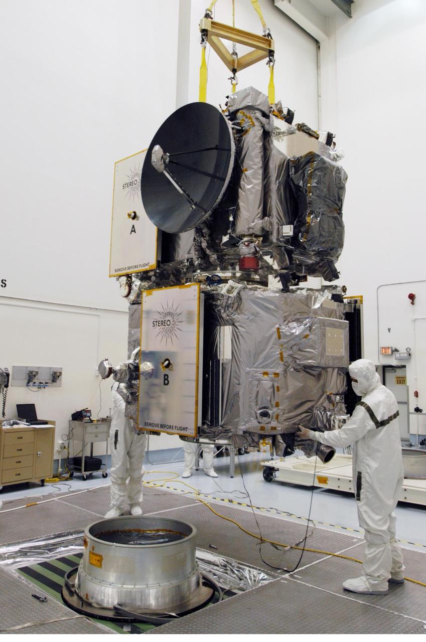KENNEDY SPACE CENTER, FLA. -  Technicians inside the Astrotech facility in Titusville, Florida, move the STEREO spacecraft to the spin table. The twin observatories will undergo a spin test to check balance and alignment in preparation for flight. STEREO stands for Solar Terrestrial Relations Observatory. The STEREO mission is the first to take measurements of the sun and solar wind in 3-dimension. This new view will improve our understanding of space weather and its impact on the Earth. STEREO is expected to lift off on Aug. 31, from Launch Pad 17-B on Cape Canaveral Air Force Station in Florida. Photo credit: NASA/George Shelton.