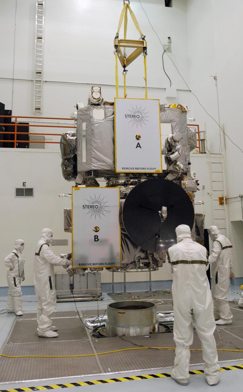 KENNEDY SPACE CENTER, FLA. -  Technicians inside the Astrotech facility in Titusville, Florida, move the STEREO spacecraft to the spin table. The twin observatories will undergo a spin test to check balance and alignment in preparation for flight. STEREO stands for Solar Terrestrial Relations Observatory. The STEREO mission is the first to take measurements of the sun and solar wind in 3-dimension. This new view will improve our understanding of space weather and its impact on the Earth. STEREO is expected to lift off on Aug. 31, from Launch Pad 17-B on Cape Canaveral Air Force Station in Florida. Photo credit: NASA/George Shelton.