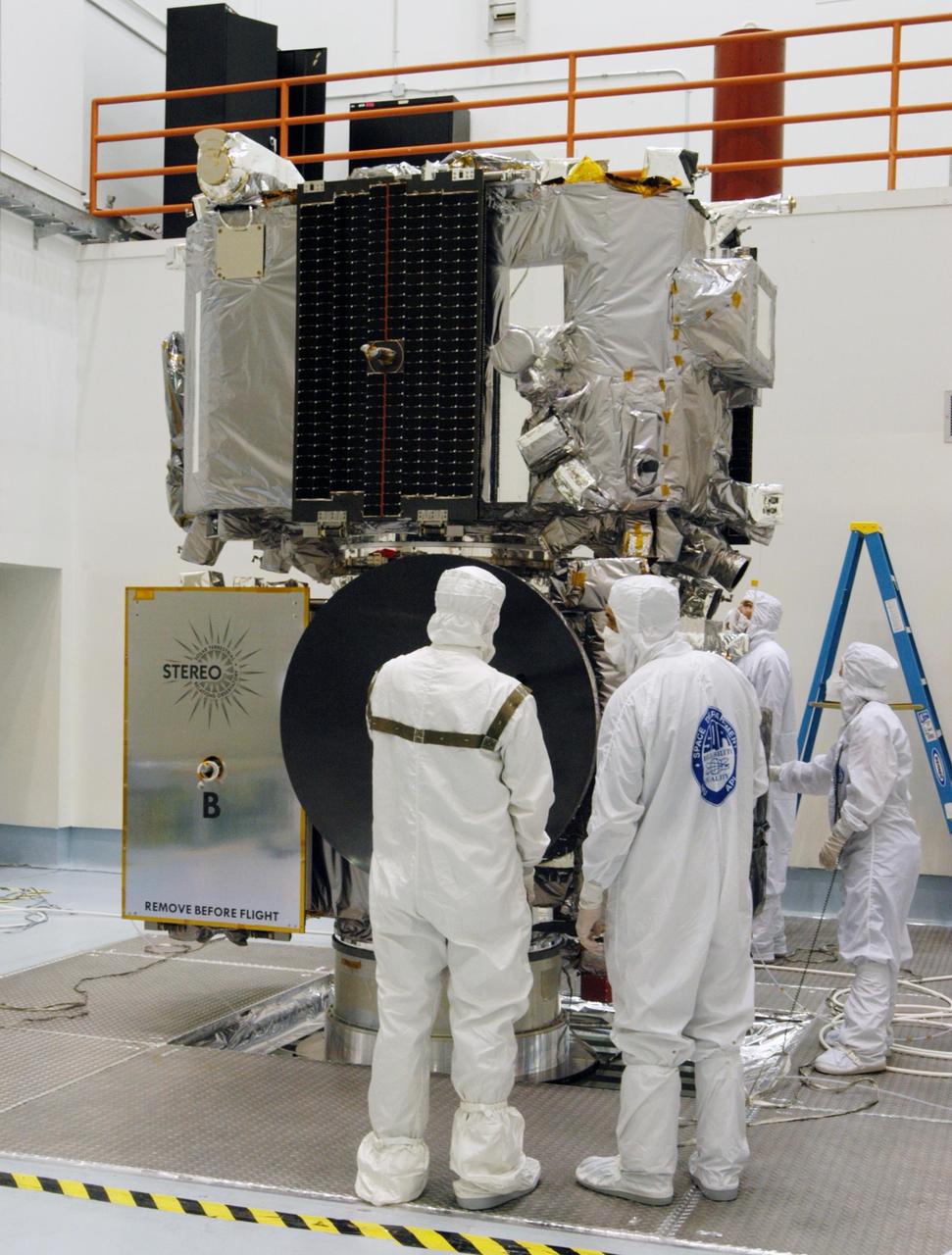 KENNEDY SPACE CENTER, FLA. -  The STEREO observatories are the focus of attention at a media viewing held at Astrotech Space Operations in Titusville, Fla., on Aug. 11.  The two observatories were mated for launch but will separate into different orbits for their mission. STEREO stands for Solar Terrestrial Relations Observatory. The STEREO mission is the first to take measurements of the sun and solar wind in 3-dimension. This new view will improve our understanding of space weather and its impact on the Earth. STEREO is expected to lift off on Aug. 31, from Launch Pad 17-B on Cape Canaveral Air Force Station in Florida. Photo credit: NASA/George Shelton.