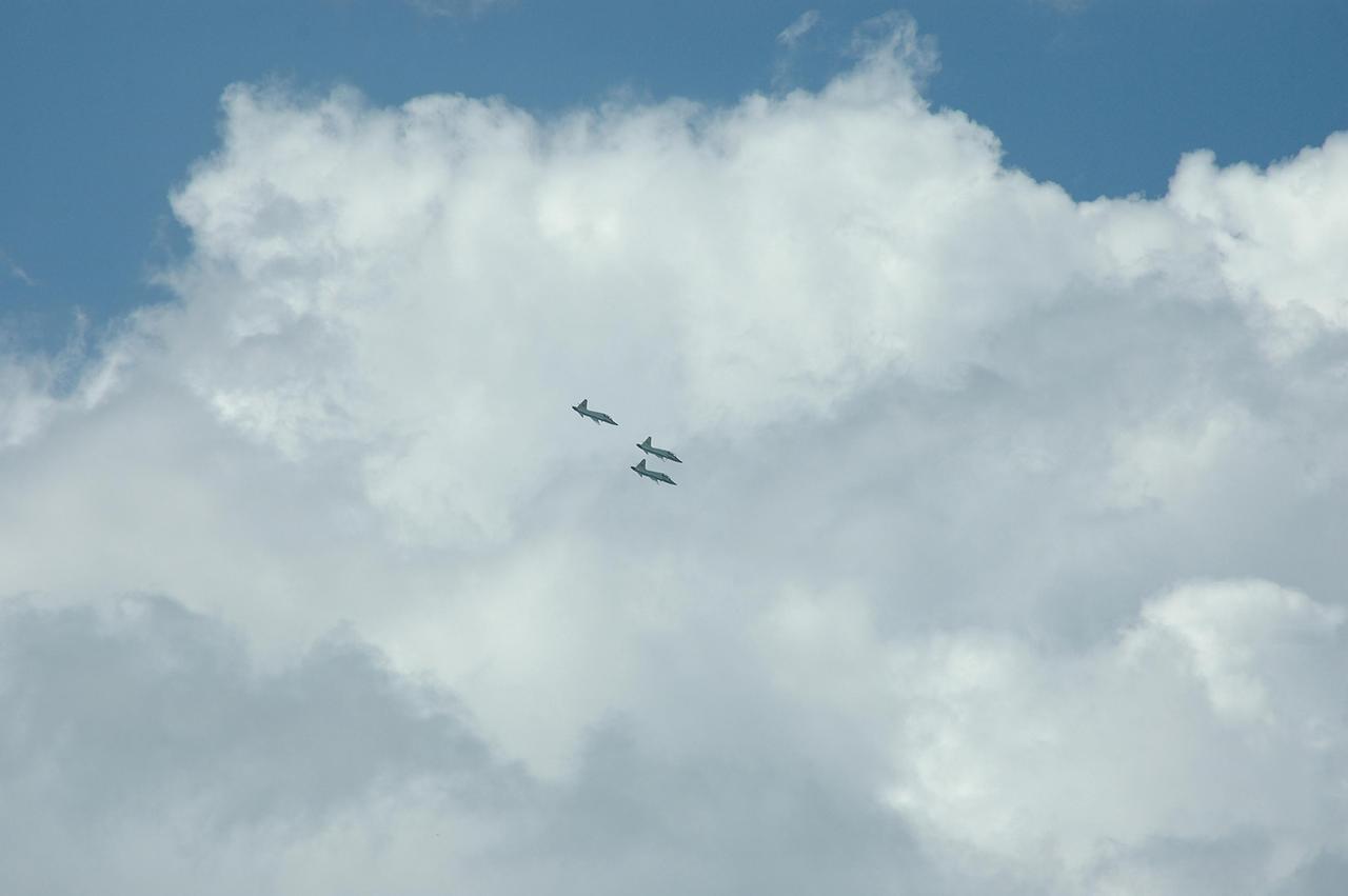 KENNEDY SPACE CENTER, FLA. - Three T-38 jet aircraft with STS-115 crew members aboard approach NASA Kennedy Space Center's Shuttle Landing Facility. The crew is arriving to prepare for launch on Aug. 27 to the International Space Station. Crew members are Commander Brent Jett, Pilot Christopher Ferguson and Mission Specialists Joseph Tanner, Daniel Burbank, Heidemarie Stefanyshyn-Piper and Steven MacLean, who represents the Canadian Space Agency. The mission will deliver and install the 17-and-a-half-ton P3/P4 truss segment to the port side of the integrated truss system on the orbital outpost. The truss includes a new set of photovoltaic solar arrays. When unfurled to their full length of 240 feet, the arrays will provide additional power for the station in preparation for the delivery of international science modules over the next two years. STS-115 is expected to last 11 days and includes three scheduled spacewalks. Photo credit: NASA/Kim Shiflett