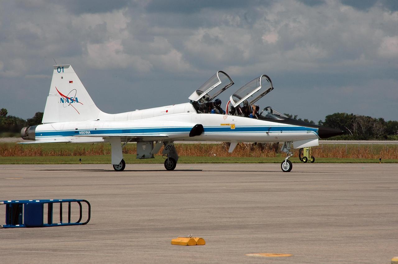 KENNEDY SPACE CENTER, FLA. - One of three T-38 jet aircraft with STS-115 crew members aboard lands at NASA Kennedy Space Center's Shuttle Landing Facility. The crew is arriving to prepare for launch on Aug. 27 to the International Space Station. Crew members are Commander Brent Jett, Pilot Christopher Ferguson and Mission Specialists Joseph Tanner, Daniel Burbank, Heidemarie Stefanyshyn-Piper and Steven MacLean, who represents the Canadian Space Agency. The mission will deliver and install the 17-and-a-half-ton P3/P4 truss segment to the port side of the integrated truss system on the orbital outpost. The truss includes a new set of photovoltaic solar arrays. When unfurled to their full length of 240 feet, the arrays will provide additional power for the station in preparation for the delivery of international science modules over the next two years. STS-115 is expected to last 11 days and includes three scheduled spacewalks. Photo credit: NASA/Kim Shiflett