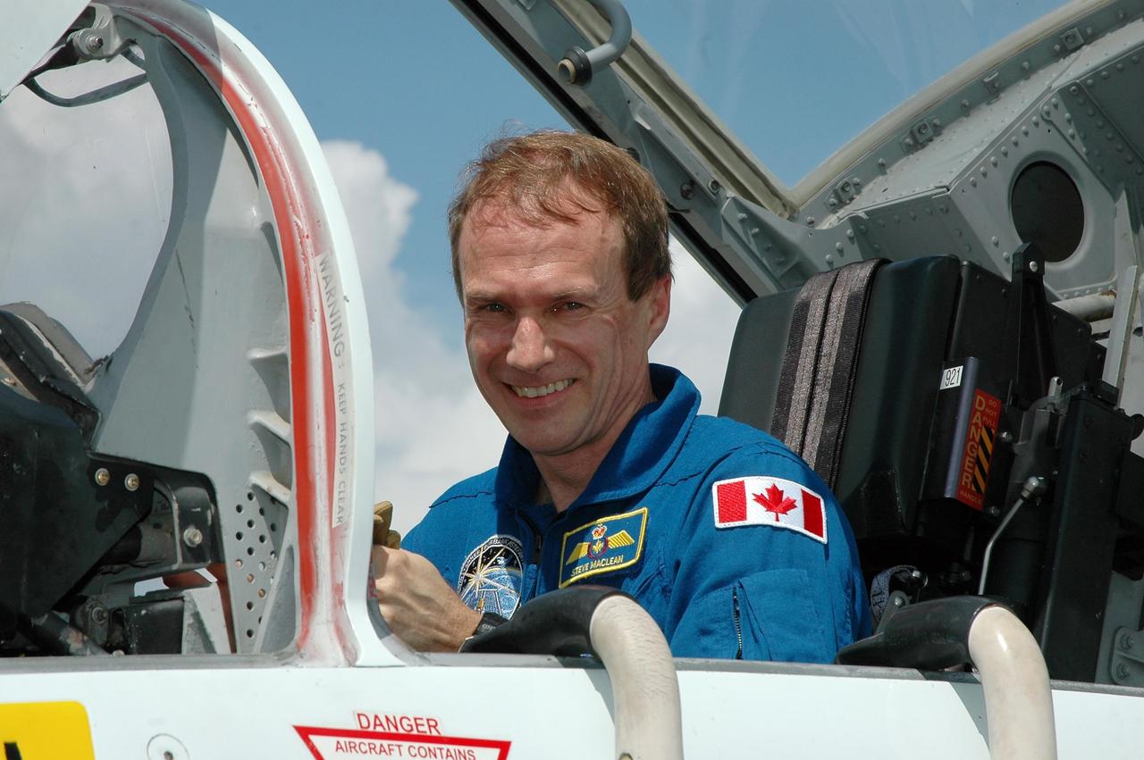 KENNEDY SPACE CENTER, FLA. - The crew of mission STS-115 arrives at NASA Kennedy Space Center's Shuttle Landing Facility to prepare for launch on Aug. 27 to the International Space Station. Seen here is Mission Specialist Steven MacLean, who will be making his second flight on the shuttle. MacLean is with the Canadian Space Agency. The mission will deliver and install the 17-and-a-half-ton P3/Pr truss segment to the port side of the integrated truss system on the orbital outpost. The truss includes a new set of photovoltaic solar arrays. When unfurled to their full length of 240 feet, the arrays will provide additional power for the station in preparation for the delivery of international science modules over the next two years. STS-115 is expected to last 11 days and includes three scheduled spacewalks. Photo credit: NASA/Kim Shiflett
