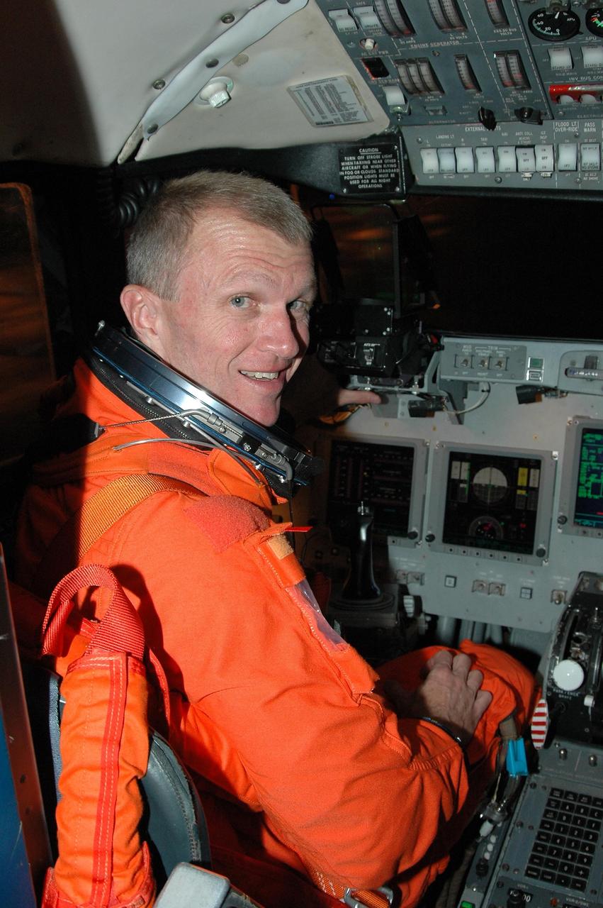 KENNEDY SPACE CENTER, FLA. -  STS-115 Commander Brent Jett settles in the cockpit of the Shuttle Training Aircraft to practice landing the shuttle.  STA practice is part of launch preparations.  The STA is a Grumman American Aviation-built Gulf Stream II jet that was modified to simulate an orbiter’s cockpit, motion and visual cues, and handling qualities. In flight, the STA duplicates the orbiter’s atmospheric descent trajectory from approximately 35,000 feet altitude to landing on a runway. Because the orbiter is unpowered during re-entry and landing, its high-speed glide must be perfectly executed the first time.  Mission STS-115 is scheduled to lift off about 4:30 p.m. Aug. 27.  The crew will deliver and install the P3/P4 segment to the port side of the integrated truss system on the International Space Station.  The truss includes a new set of photovoltaic solar arrays.  When unfurled to their full length of 240 feet, the arrays will provide additional power for the station in preparation for the delivery of international science modules over the next two years.  The mission is expected to last 11 days and includes three scheduled spacewalks.   Photo credit: NASA/Kim Shiflett