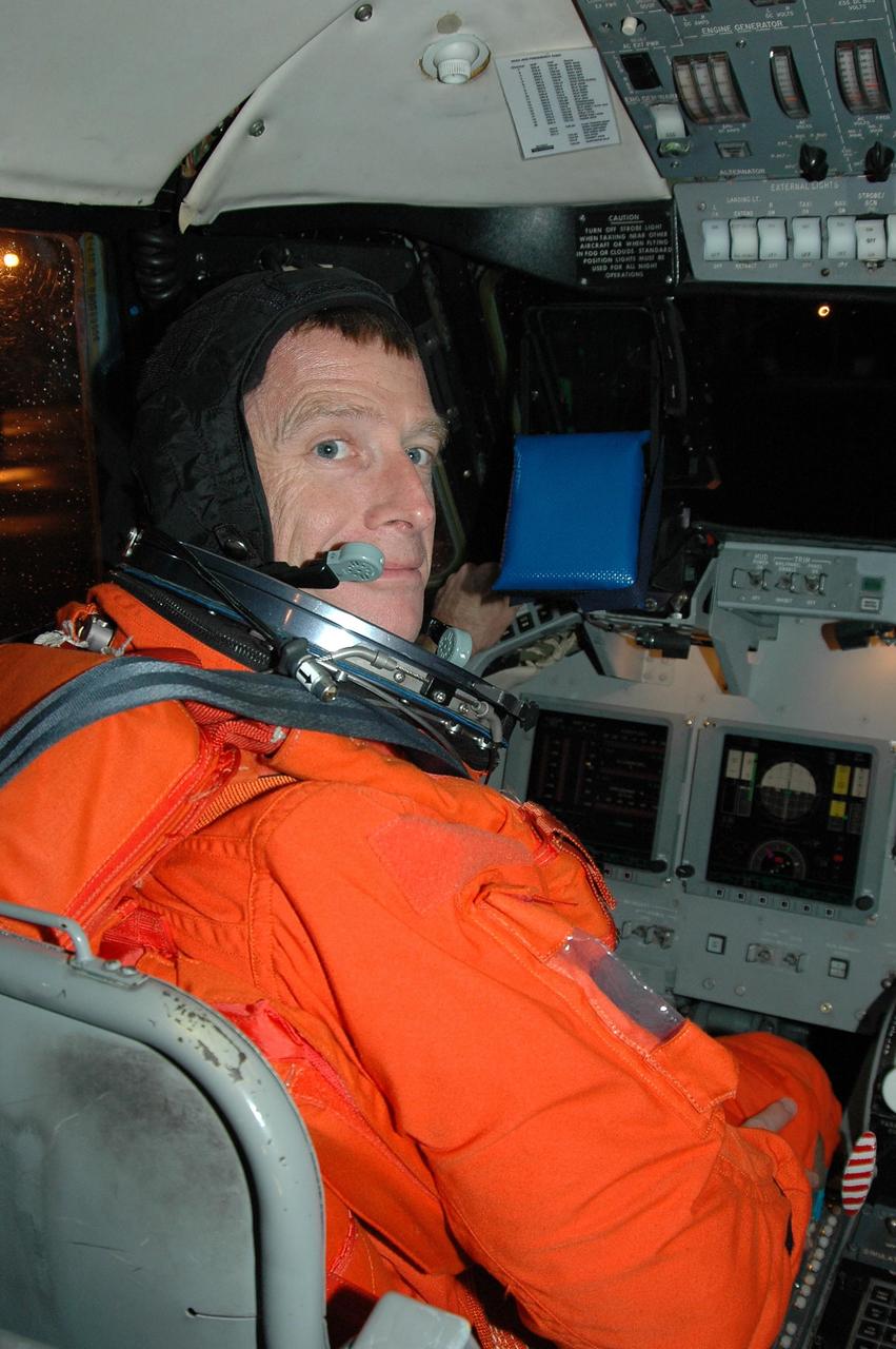 KENNEDY SPACE CENTER, FLA. -  STS-115 Pilot Christopher Ferguson settles in the cockpit of the Shuttle Training Aircraft to practice landing the shuttle.  STA practice is part of launch preparations. The STA is a Grumman American Aviation-built Gulf Stream II jet that was modified to simulate an orbiter’s cockpit, motion and visual cues, and handling qualities. In flight, the STA duplicates the orbiter’s atmospheric descent trajectory from approximately 35,000 feet altitude to landing on a runway. Because the orbiter is unpowered during re-entry and landing, its high-speed glide must be perfectly executed the first time.  Mission STS-115 is scheduled to lift off about 4:30 p.m. Aug. 27.  The crew will deliver and install the P3/P4 segment to the port side of the integrated truss system on the International Space Station.  The truss includes a new set of photovoltaic solar arrays.  When unfurled to their full length of 240 feet, the arrays will provide additional power for the station in preparation for the delivery of international science modules over the next two years.  The mission is expected to last 11 days and includes three scheduled spacewalks.   Photo credit: NASA/Kim Shiflett