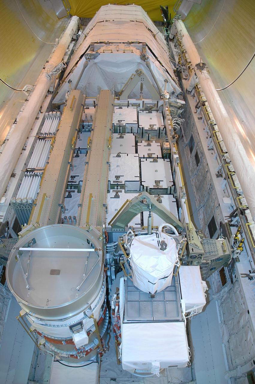 KENNEDY SPACE CENTER, FLA. -   On Launch Pad 39B, the cargo in Space Shuttle Atlantis' payload bay is seen before the closing of the bay doors.  The cargo is the 17-and-a-half-ton P3/P4 truss segment for the International Space Station. Scheduled to launch Aug. 27, Atlantis will fly on mission STS-115 with a crew of six to deliver and install the P3/P4 segment to the port side of the integrated truss system on the orbital outpost.  The truss includes a new set of photovoltaic solar arrays.  When unfurled to their full length of 240 feet, the arrays will provide additional power for the station in preparation for the delivery of international science modules over the next two years.  STS-115 is expected to last 11 days and includes three scheduled spacewalks.  Photo credit: NASA/Jack Pfaller
