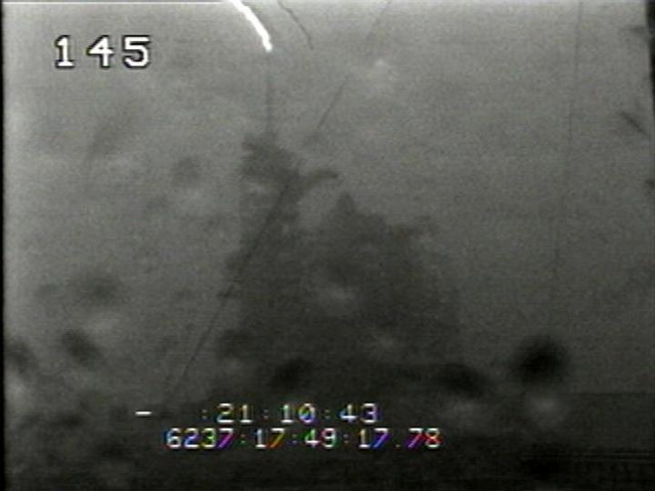 KENNEDY SPACE CENTER, FLA. -  A lightning strike occurred at the lightning protection system of Launch Pad 39B on Fri., August 25, 2006, at 1:49:17 p.m. (EST). The lightning strike caused the mission management team to scrub the launch of mission STS-115 for 24 hours in order to review all electrical systems on the space shuttle and the launch pad ground support equipment. Photo credit: NASA/InDyne -Operational Television.