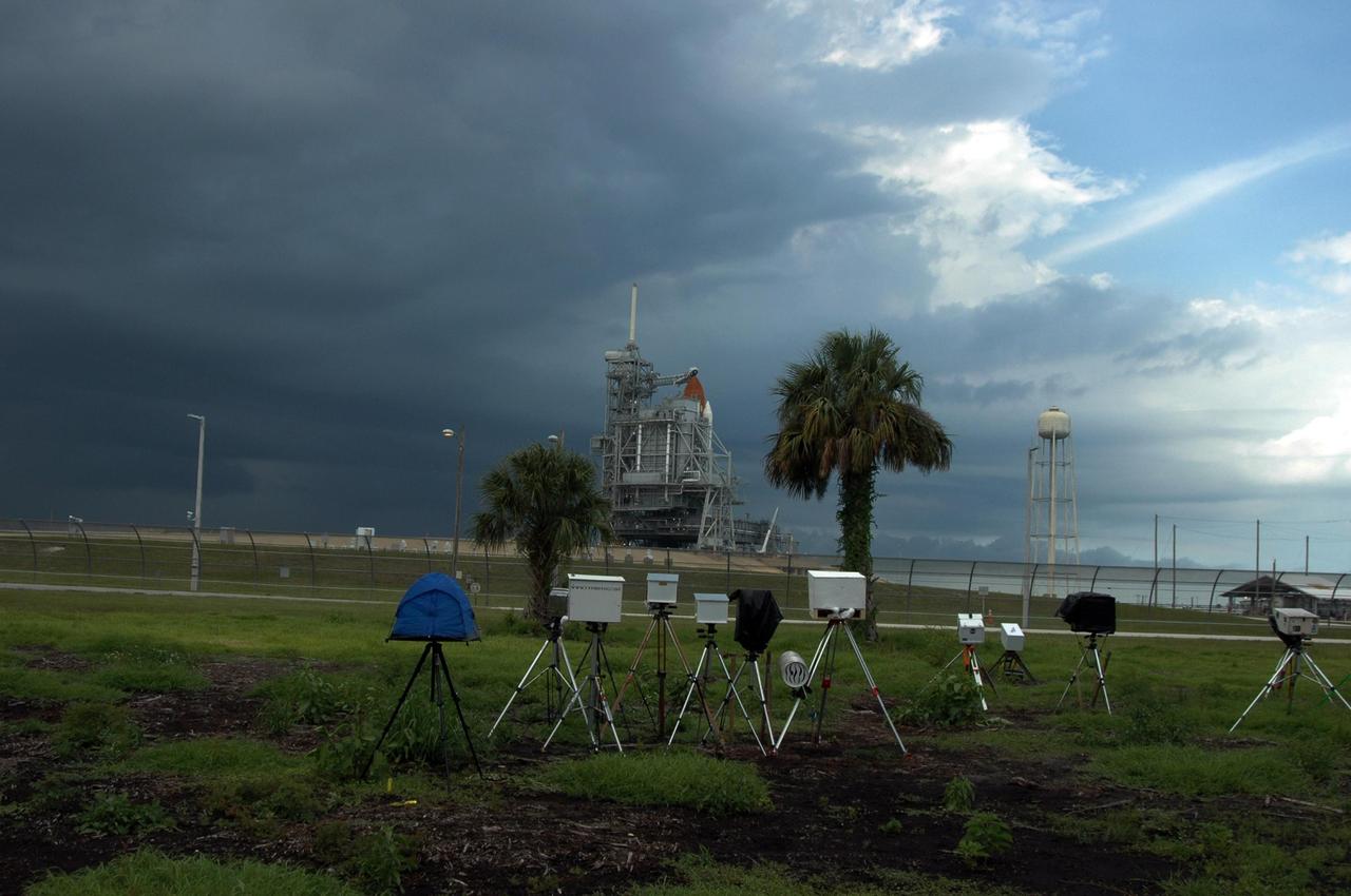 KENNEDY SPACE CENTER, FLA. -  Several remote cameras are positioned around the perimeter of Launch Pad 39B in preparation for the launch of mission STS-115 aboard Space Shuttle Atlantis. A lightning strike to the pad's lightning protection system on August 25, caused the mission management team to postpone the launch of mission STS-115 for 24 hours in order to review all electrical systems on the space shuttle and ground support equipment at the pad. Photo credit: NASA/Ken Thornsley.