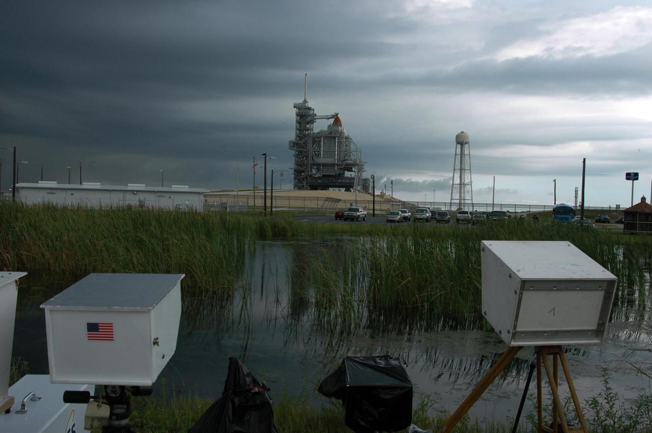 KENNEDY SPACE CENTER, FLA. -  Several remote cameras are positioned around the perimeter of Launch Pad 39B in preparation for the launch of mission STS-115 aboard Space Shuttle Atlantis. A lightning strike to the pad's lightning protection system on August 25, caused the mission management team to postpone the launch of mission STS-115 for 24 hours in order to review all electrical systems on the space shuttle and ground support equipment at the pad. Photo credit: NASA/Ken Thornsley.