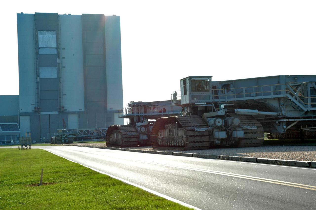 KENNEDY SPACE CENTER, FLA. -   Both  of NASA's crawler-transporters are seen parked in their area near the Vehicle Assembly Building. Crawler-transporter No. 2 is being checked before it is needed to move the STS-116 stack from VAB high bay 3 to high bay 2 and allow the rollback of Space Shuttle Atlantis into high bay 3.  Crawler No. 1 will transport the shuttle from the pad. The rollback will be determined by the mission management team based on information about Hurricane Ernesto and its path through Florida. Atlantis has been poised on Launch Pad 39B for liftoff on mission STS-115 to the International Space Station to deliver the P3/P4 truss segment.  Photo credit: NASA/Jack Pfaller