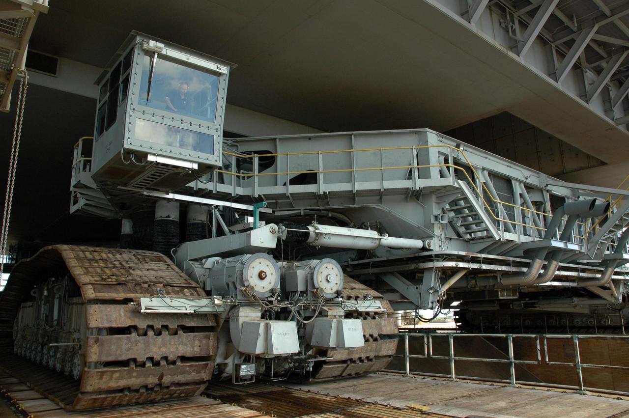 KENNEDY SPACE CENTER, FLA. - One of the crawler engineers is seen inside the cab on the corner of the crawler transporter. The crawler is moving the Space Shuttle Atlantis and mobile launcher platform back to the Vehicle Assembly Building. First motion off the pad was at 10:04 a.m. EDT. The rollback is a safety precaution as the area waits for the arrival of Tropical Storm Ernesto. The storm is forecast to be bringing 58-mph to 70-mph winds in the next 24 hours. The shuttle will be moved into high bay 2, on the southwest side of the VAB, for protection from the storm. Photo credit: NASA/Jack Pfaller