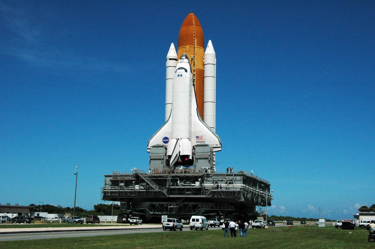 KENNEDY SPACE CENTER, FLA. -    On the crawlerway, Space Shuttle Atlantis reverses direction and begins rolling back out to Launch Pad 39B.  It had been moved off the launch pad due to concerns about the impact of Tropical Storm Ernesto, expected within 24 hours.  The forecast of lesser winds expected from Ernesto and its projected direction convinced Launch Integration Manager LeRoy Cain and Shuttle Launch Director Mike Leinbach to return the shuttle to the launch pad.   Photo credit: NASA/Ken Thornsley