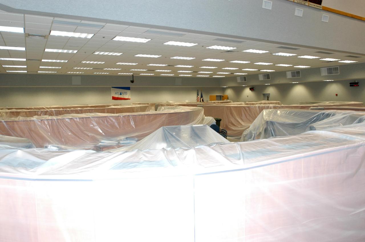 KENNEDY SPACE CENTER, FLA. - Equipment in areas of the Launch Control Center at NASA's Kennedy Space Center are wrapped in protective covers for the arrival of Tropical Storm Ernesto in Central Florida. The storm is forecast to be bringing 58-mph to 70-mph winds in the next 24 hours. Photo credit: NASA/George Shelton
