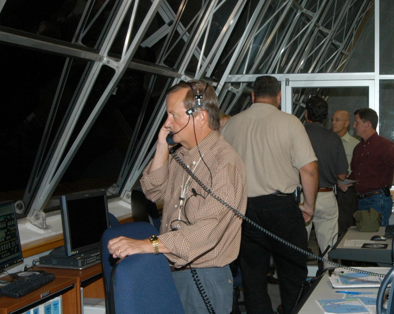 KENNEDY SPACE CENTER, FLA. -    Inside the Launch Control Center at NASA's Kennedy Space Center, Shuttle Launch Director Mike Leinbach informs the launch team of the decision to reverse the rollback of Space Shuttle Atlantis and return to Launch Pad 39B.  Photo credit: NASA/George Shelton