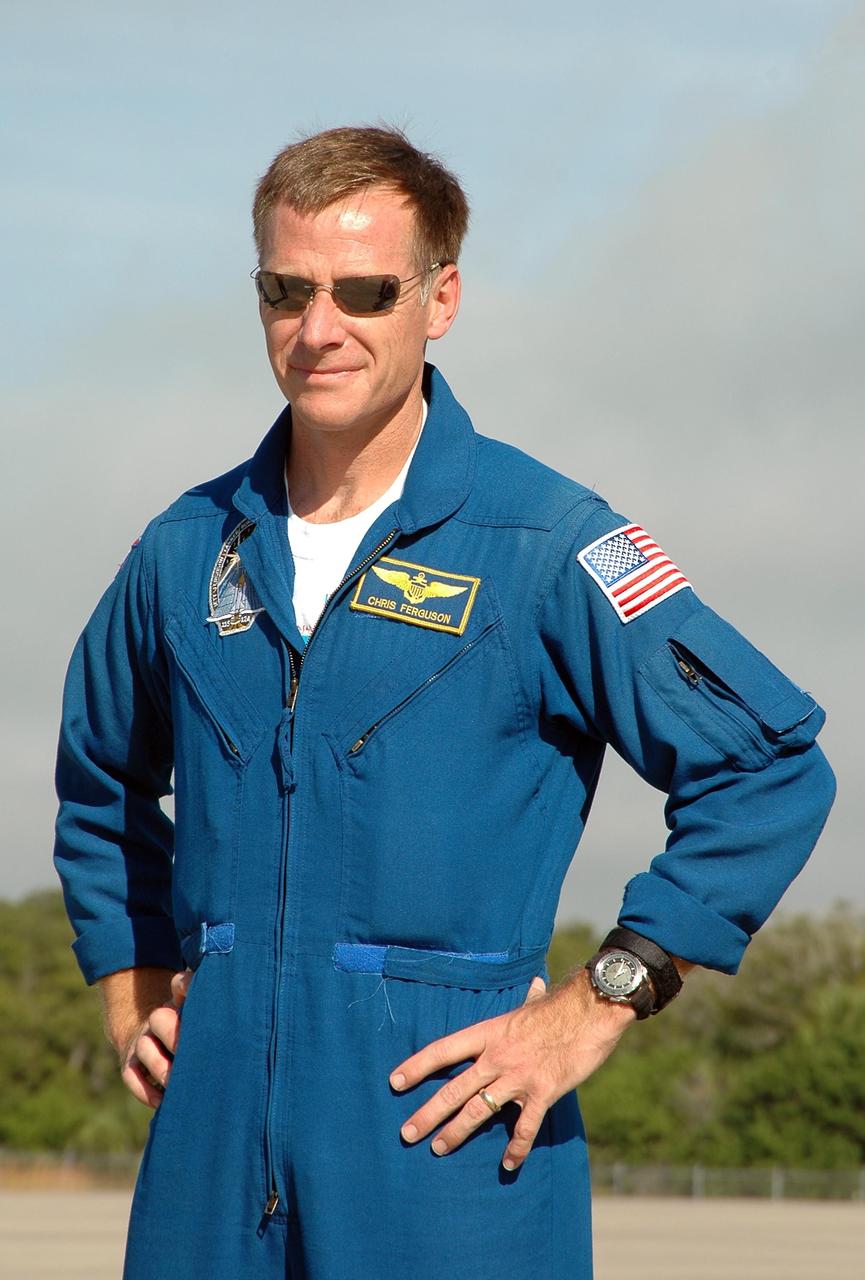 KENNEDY SPACE CENTER, FLA. - The crew of mission STS-115 arrives at NASA Kennedy Space Center's Shuttle Landing Facility to prepare for a second launch attempt on Sept. 6 to the International Space Station. Seen here is Pilot Christopher Ferguson, who will be making his first flight on the shuttle. Mission managers cancelled Atlantis' first launch campaign due to a lightning strike at the pad and the passage of Tropical Storm Ernesto along Florida's east coast. The mission will deliver and install the 17-and-a-half-ton P3/P4 truss segment to the port side of the integrated truss system on the orbital outpost. The truss includes a new set of photovoltaic solar arrays. When unfurled to their full length of 240 feet, the arrays will provide additional power for the station in preparation for the delivery of international science modules over the next two years. STS-115 is expected to last 11 days and includes three scheduled spacewalks. Photo credit: NASA/Kim Shiflett