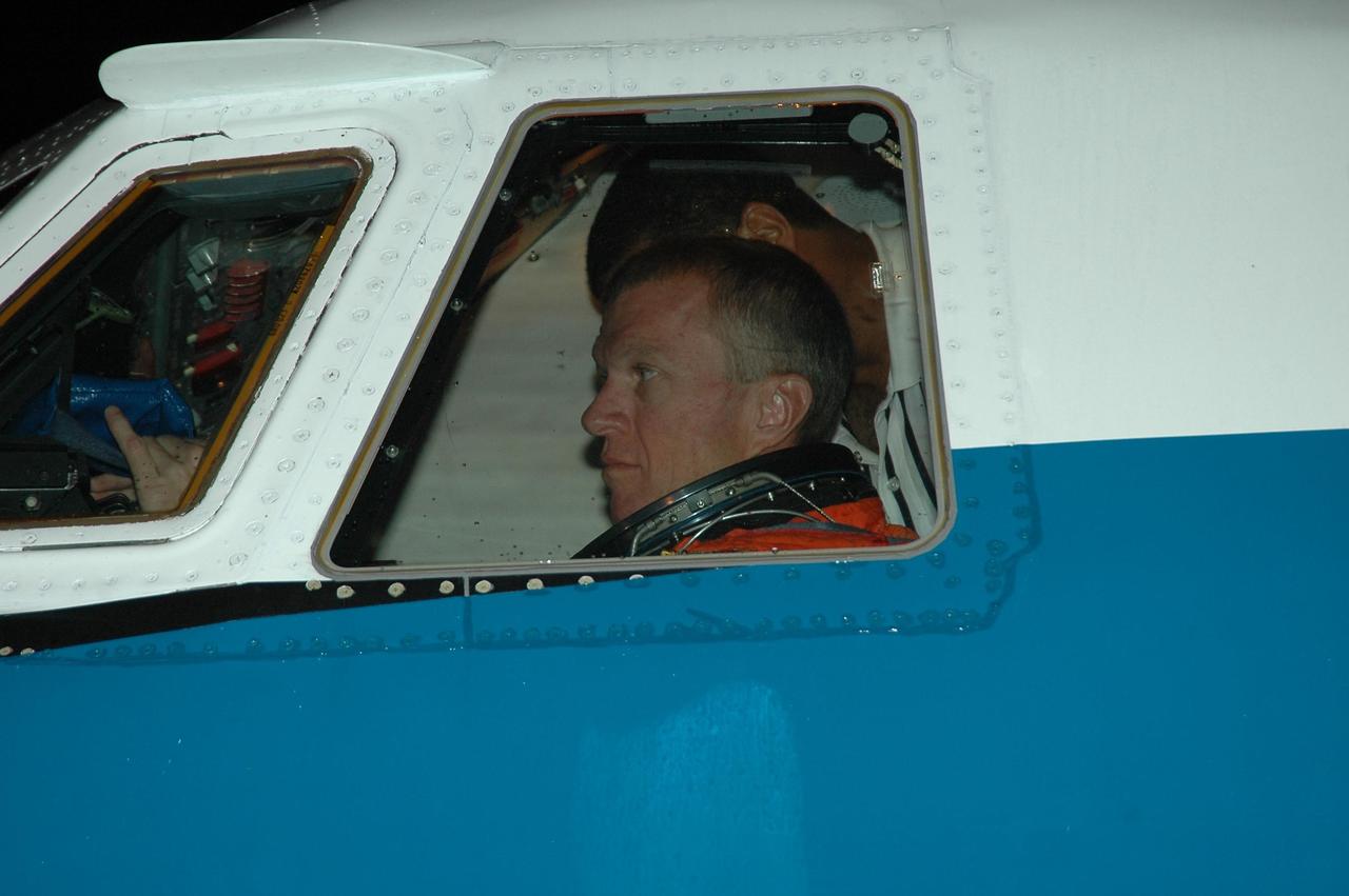 KENNEDY SPACE CENTER, FLA. - STS-115 Commander Brent Jett settles in the cockpit of the Shuttle Training Aircraft to practice landing the shuttle. STA practice is part of launch preparations. The STA is a Grumman American Aviation-built Gulf Stream II jet that was modified to simulate an orbiter’s cockpit, motion and visual cues, and handling qualities. In flight, the STA duplicates the orbiter’s atmospheric descent trajectory from approximately 35,000 feet altitude to landing on a runway. Because the orbiter is unpowered during re-entry and landing, its high-speed glide must be perfectly executed the first time. Mission STS-115 is scheduled to lift off about 12:29 p.m. Sept. 6. Mission managers cancelled Atlantis' first launch campaign due to a lightning strike at the pad and the passage of Tropical Storm Ernesto along Florida's east coast. The mission will deliver and install the 17-and-a-half-ton P3/P4 truss segment to the port side of the integrated truss system on the orbital outpost. The truss includes a new set of photovoltaic solar arrays. When unfurled to their full length of 240 feet, the arrays will provide additional power for the station in preparation for the delivery of international science modules over the next two years. STS-115 is expected to last 11 days and includes three scheduled spacewalks. Photo credit: NASA/Kim Shiflett