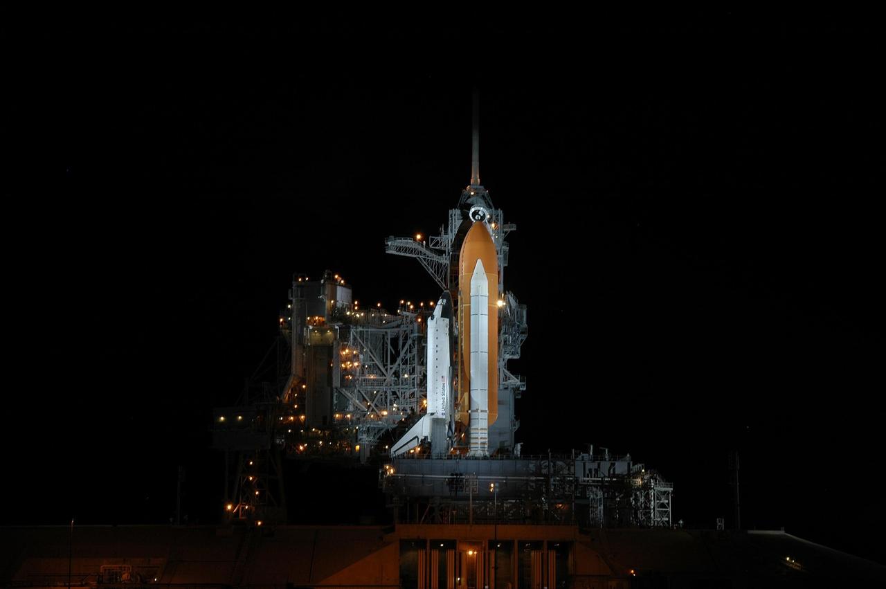 KENNEDY SPACE CENTER, FLA. - Space Shuttle Atlantis is bathed in light on Launch Pad 39B. Atlantis was originally scheduled to launch at 12:29 p.m. EDT on this date, but a 24-hour scrub was called by mission managers due to a concern with Fuel Cell 1. During the STS-115 mission, Atlantis' astronauts will deliver and install the 17.5-ton, bus-sized P3/P4 integrated truss segment on the station. The girder-like truss includes a set of giant solar arrays, batteries and associated electronics and will provide one-fourth of the total power-generation capability for the completed station. This mission is the 116th space shuttle flight, the 27th flight for orbiter Atlantis, and the 19th U.S. flight to the International Space Station. STS-115 is scheduled to last 11 days with a planned landing at KSC. Photo credit: NASA/Jim Grossmann