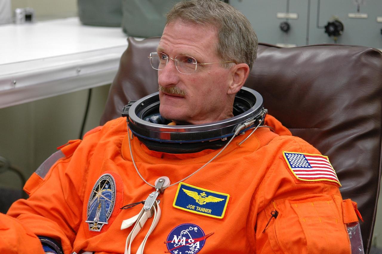 KENNEDY SPACE CENTER, FLA. -  In the Operations and Checkout Building at NASA Kennedy Space Center, STS-115 Mission Specialist Joseph Tanner waits to complete suiting up before heading to the launch pad.  Tanner is making his fourth shuttle flight on this mission to the International Space Station aboard Space Shuttle Atlantis.  On its second attempt for launch, Atlantis is scheduled to lift off at 11:41 a.m. EDT today from Launch Pad 39B.  During the STS-115 mission, Atlantis' astronauts will deliver and install the 17.5-ton, bus-sized P3/P4 integrated truss segment on the station. The girder-like truss includes a set of giant solar arrays, batteries and associated electronics and will provide one-fourth of the total power-generation capability for the completed station. This mission is the 116th space shuttle flight, the 27th flight for orbiter Atlantis, and the 19th U.S. flight to the ISS. STS-115 is scheduled to last 11 days with a planned landing at KSC.  Photo credit: NASA/Kim Shiflett