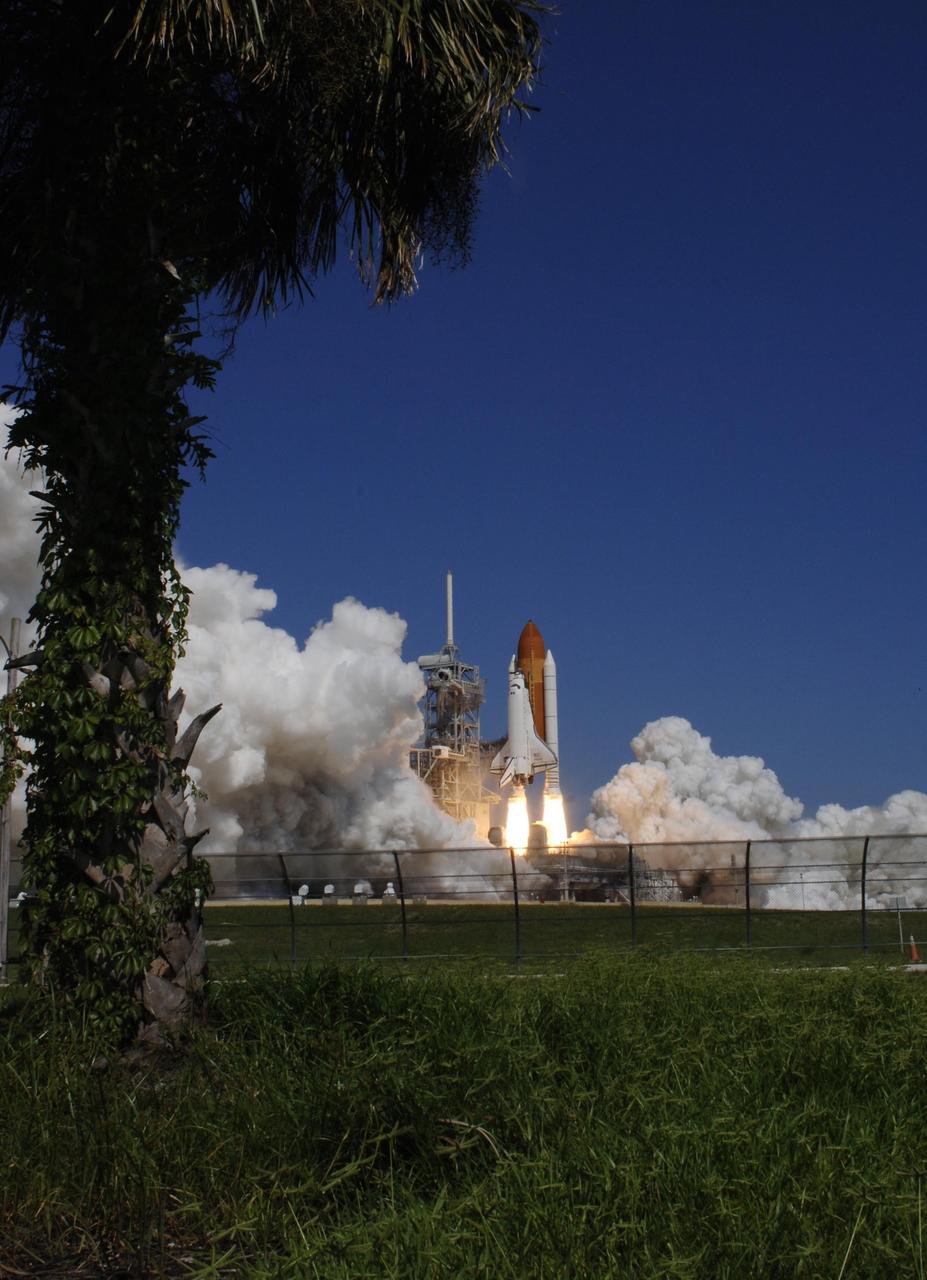 KENNEDY SPACE CENTER, FLA. -  Although it appears to be standing on twin columns of fire, Space Shuttle Atlantis leaps off the launch pad, heading toward space for a rendezvous with the International Space Station on mission STS-115.  Liftoff was on-time at 11:14:55 a.m. EDT.  After launch attempts were scrubbed Aug. 27 and 29 and Sept. 3 and 8 due to weather and technical concerns,  this launch was executed perfectly.  Mission STS-115 is the 116th space shuttle flight, the 27th flight for orbiter Atlantis, and the 19th U.S. flight to the International Space Station. During the mission, Atlantis' astronauts will deliver and install the 17.5-ton, bus-sized P3/P4 integrated truss segment on the station. The girder-like truss includes a set of giant solar arrays, batteries and associated electronics and will provide one-fourth of the total power-generation capability for the completed station. STS-115 is scheduled to last 11 days with a planned landing at KSC. Photo credit: NASA/Sandra Joseph & Robert Murray