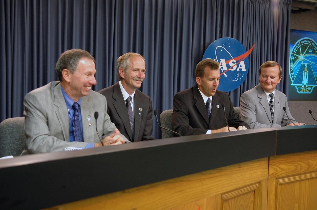 KENNEDY SPACE CENTER, FLA. -   NASA and KSC officials discuss the successful launch of Space Shuttle Atlantis on mission STS-115 at a press conference at NASA's Kennedy Space Center.  From left are NASA Administrator Michael Griffin, Associate Administrator for Space Operations Mission William Gerstenmaier, Launch Integration Director LeRoy Cain and Shuttle Launch Director Mike Leinbach.Mission STS-115 is the 116th space shuttle flight, the 27th flight for orbiter Atlantis, and the 19th U.S. flight to the International Space Station. STS-115 is scheduled to last 11 days with a planned landing at KSC. Photo credit: NASA/Kim Shiflett