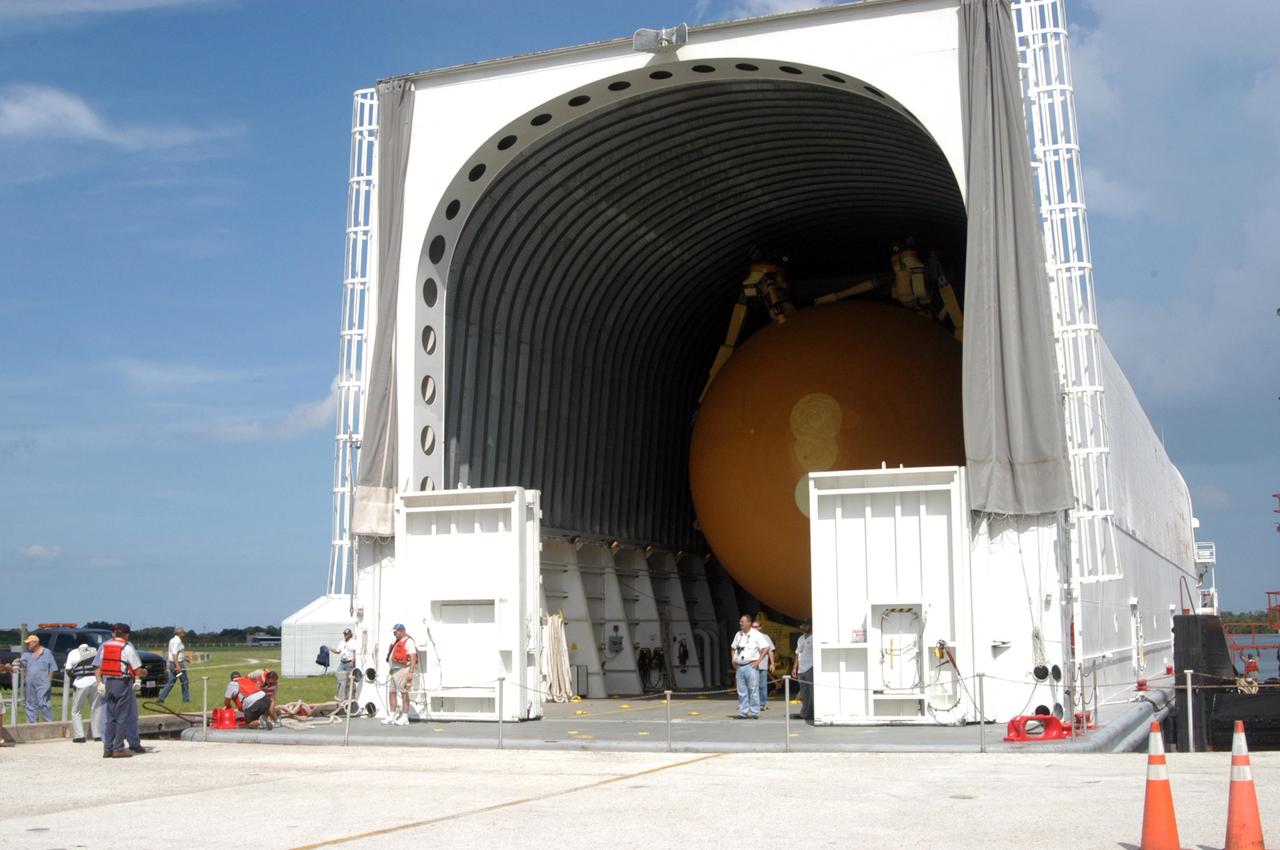 KENNEDY SPACE CENTER, FLA. - Inside the Pegasus barge can be seen external tank No. 123, designated to launch Space Shuttle Discovery on mission STS-116 in December. Now docked at the turn basin dock in the Launch Complex 39 Area at NASA's Kennedy Space Center, the barge was towed from NASA's Michoud Assembly Facility in New Orleans. The tank has undergone major safety changes, including removal of the protuberance air load ramps. The tank will be offloaded and transported to the Vehicle Assembly Building. Mission STS-116 will deliver the P5 truss segment, a SPACEHAB module and other key components to the International Space Station. Launch is currently scheduled no earlier than Dec. 14. Photo credit: NASA/George Shelton