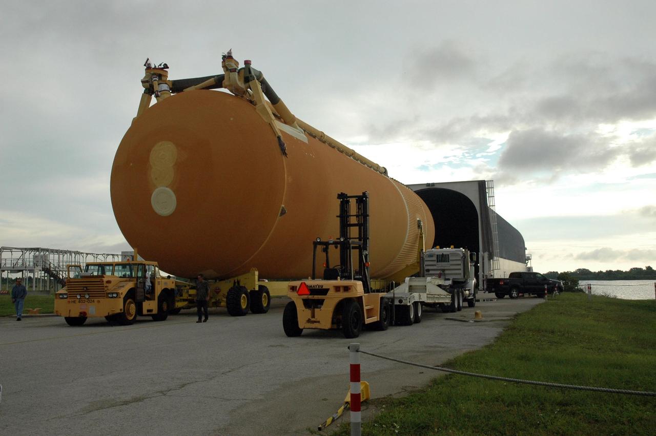 KENNEDY SPACE CENTER, FLA. - External tank No. 123 is offloaded from the Pegasus barge in the turn basin at the Launch Complex 39 Area. Designated to launch Space Shuttle Discovery on mission STS-116 in December, the tank is being moved to the Vehicle Assembly Building where it will be lifted into a checkout cell for further work. The tank, which was shipped from NASA's Michoud Assembly Facility in New Orleans, has undergone major safety changes, including removal of the protuberance air load ramps. Mission STS-116 will deliver the P5 truss segment, a SPACEHAB module and other key components to the International Space Station. Launch is currently scheduled no earlier than Dec. 14. Photo credit: NASA/Jack Pfaller