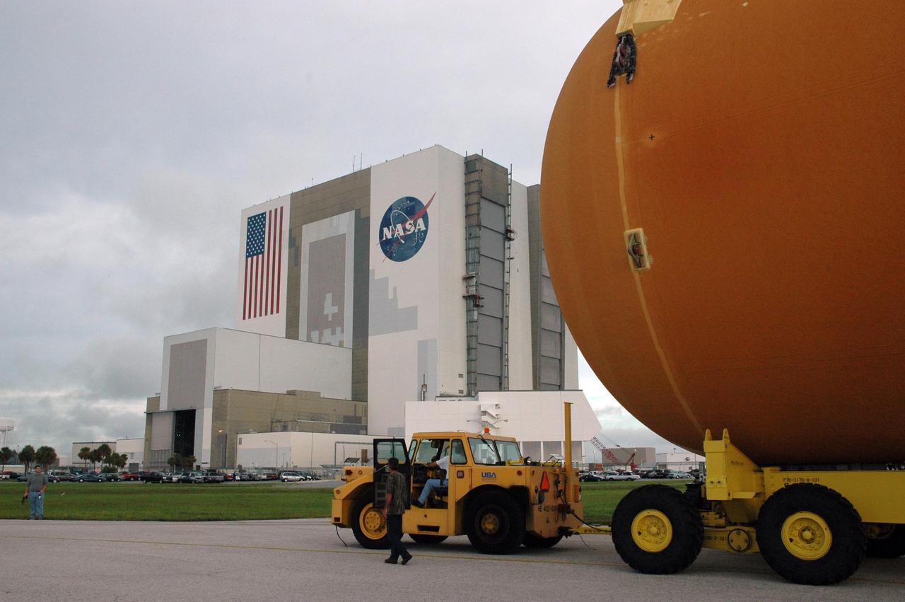 KENNEDY SPACE CENTER, FLA. -   External tank No. 123 is being transported from the Pegasus barge in the turn basin at the Launch Complex 39 Area to the Vehicle Assembly Building where it will be lifted into a checkout cell for further work.  The tank, shipped from NASA's Michoud Assembly Facility in New Orleans, has undergone major safety changes, including removal of the protuberance air load ramps.  It is designated to launch Space Shuttle Discovery on mission STS-116 in December.  Mission STS-116 will deliver the P5 truss segment, a SPACEHAB module and other key components to the International Space Station.  Launch is currently scheduled no earlier than Dec. 14.  Photo credit: NASA/Jack Pfaller
