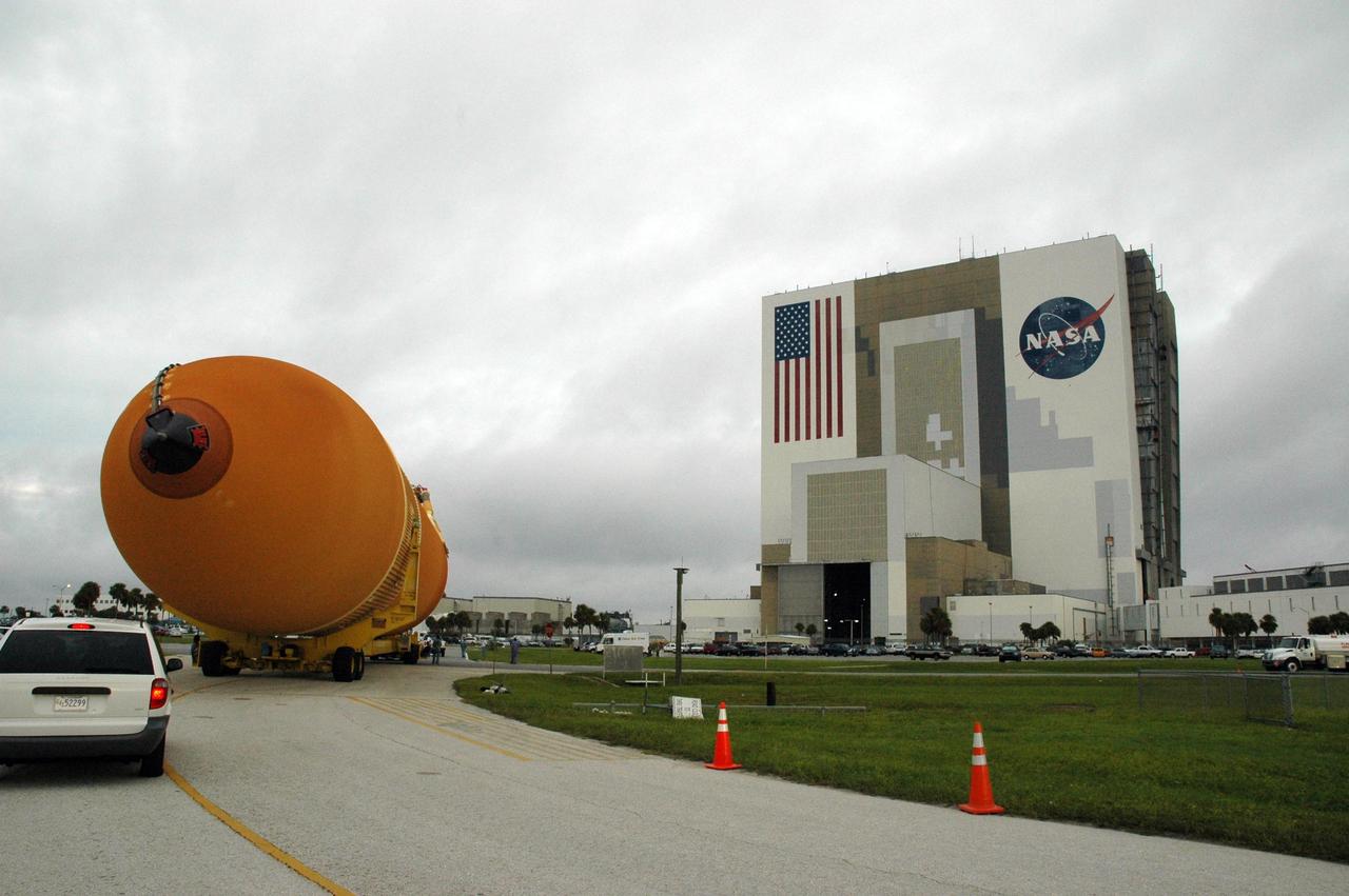 KENNEDY SPACE CENTER, FLA. - External tank No. 123 makes the turn toward the Vehicle Assembly Building after being offloaded from the Pegasus barge in the turn basin at the Launch Complex 39 Area. Once inside the VAB, the tank will be lifted into a checkout cell for further work. Shipped from NASA's Michoud Assembly Facility in New Orleans, the tank has undergone major safety changes, including removal of the protuberance air load ramps. It is designated to launch Space Shuttle Discovery on mission STS-116 in December. Mission STS-116 will deliver the P5 truss segment, a SPACEHAB module and other key components to the International Space Station. Launch is currently scheduled no earlier than Dec. 14. Photo credit: NASA/Jack Pfaller