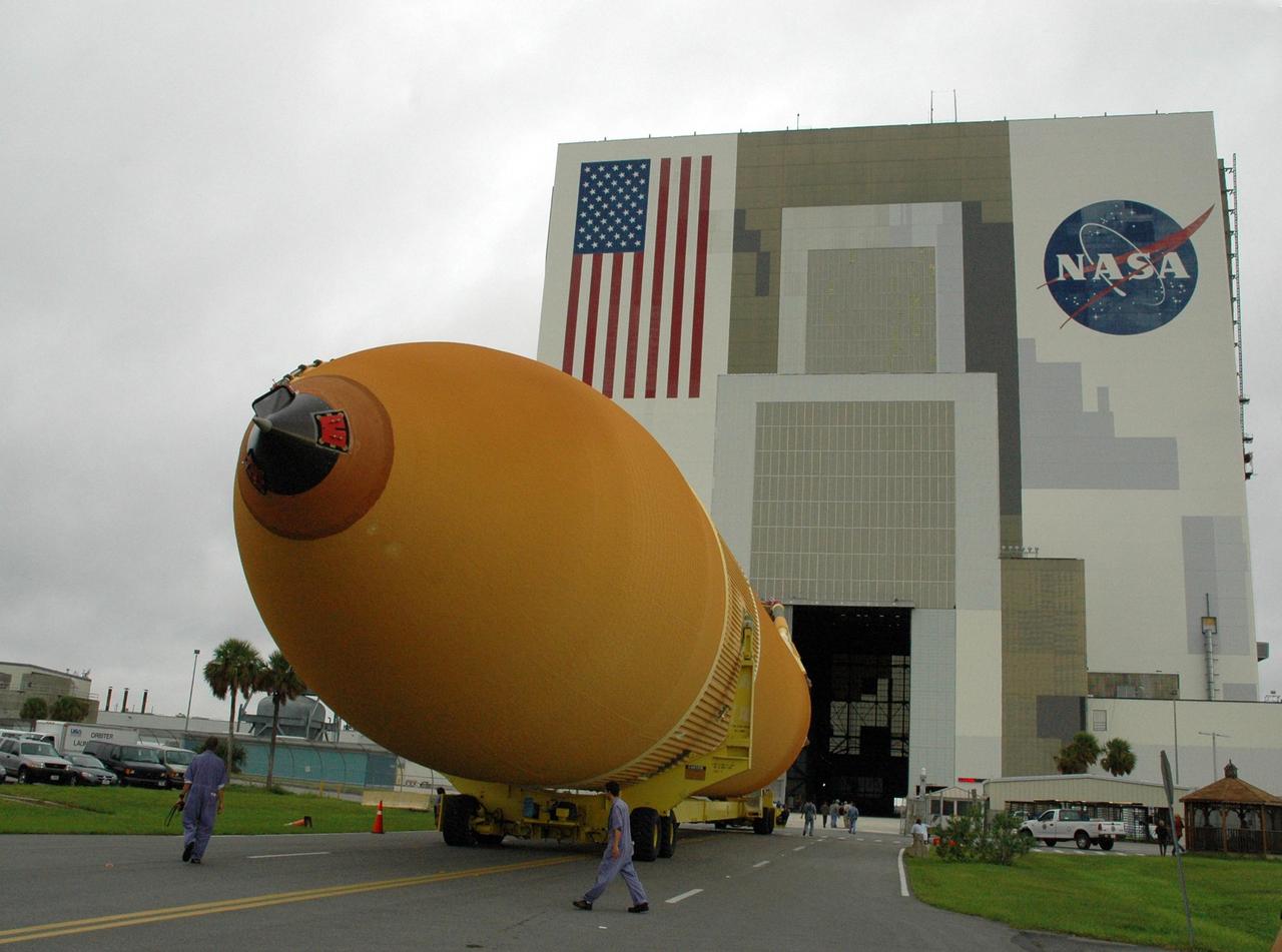 KENNEDY SPACE CENTER, FLA. -   External tank No. 123 heads toward the open doorway of the Vehicle Assembly Building. Once inside the VAB, the tank will be lifted into a checkout cell for further work.  Shipped from NASA's Michoud Assembly Facility in New Orleans aboard the Pegasus barge, the tank has undergone major safety changes, including removal of the protuberance air load ramps.  It is designated to launch Space Shuttle Discovery on mission STS-116 in December.  Mission STS-116 will deliver the P5 truss segment, a SPACEHAB module and other key components to the International Space Station.  Launch is currently scheduled no earlier than Dec. 14.  Photo credit: NASA/Jack Pfaller