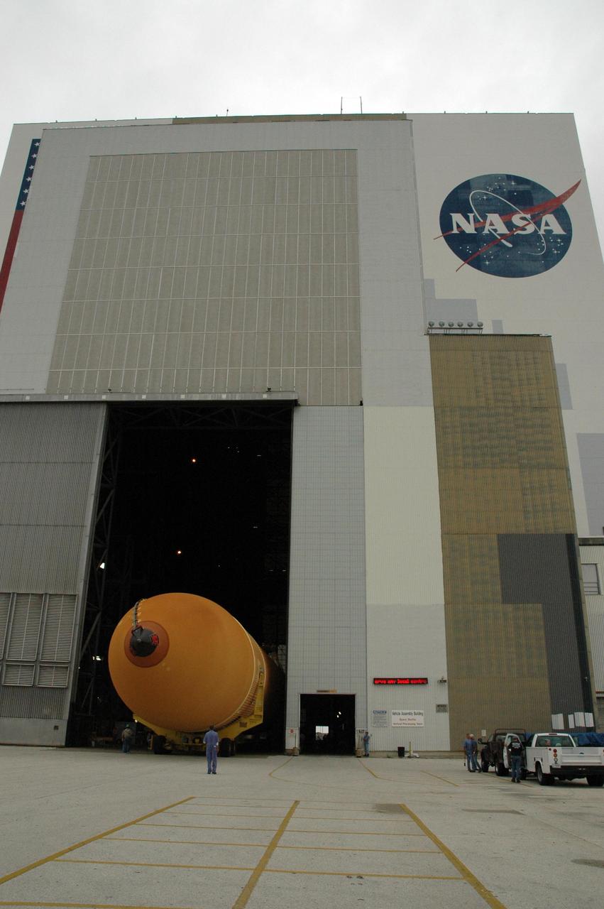 KENNEDY SPACE CENTER, FLA. -  External tank No. 123 moves into the Vehicle Assembly Building where it will be lifted into a checkout cell for further work.  Shipped from NASA's Michoud Assembly Facility in New Orleans aboard the Pegasus barge, the tank has undergone major safety changes, including removal of the protuberance air load ramps.  It is designated to launch Space Shuttle Discovery on mission STS-116 in December.  Mission STS-116 will deliver the P5 truss segment, a SPACEHAB module and other key components to the International Space Station.  Launch is currently scheduled no earlier than Dec. 14.  Photo credit: NASA/Jack Pfaller