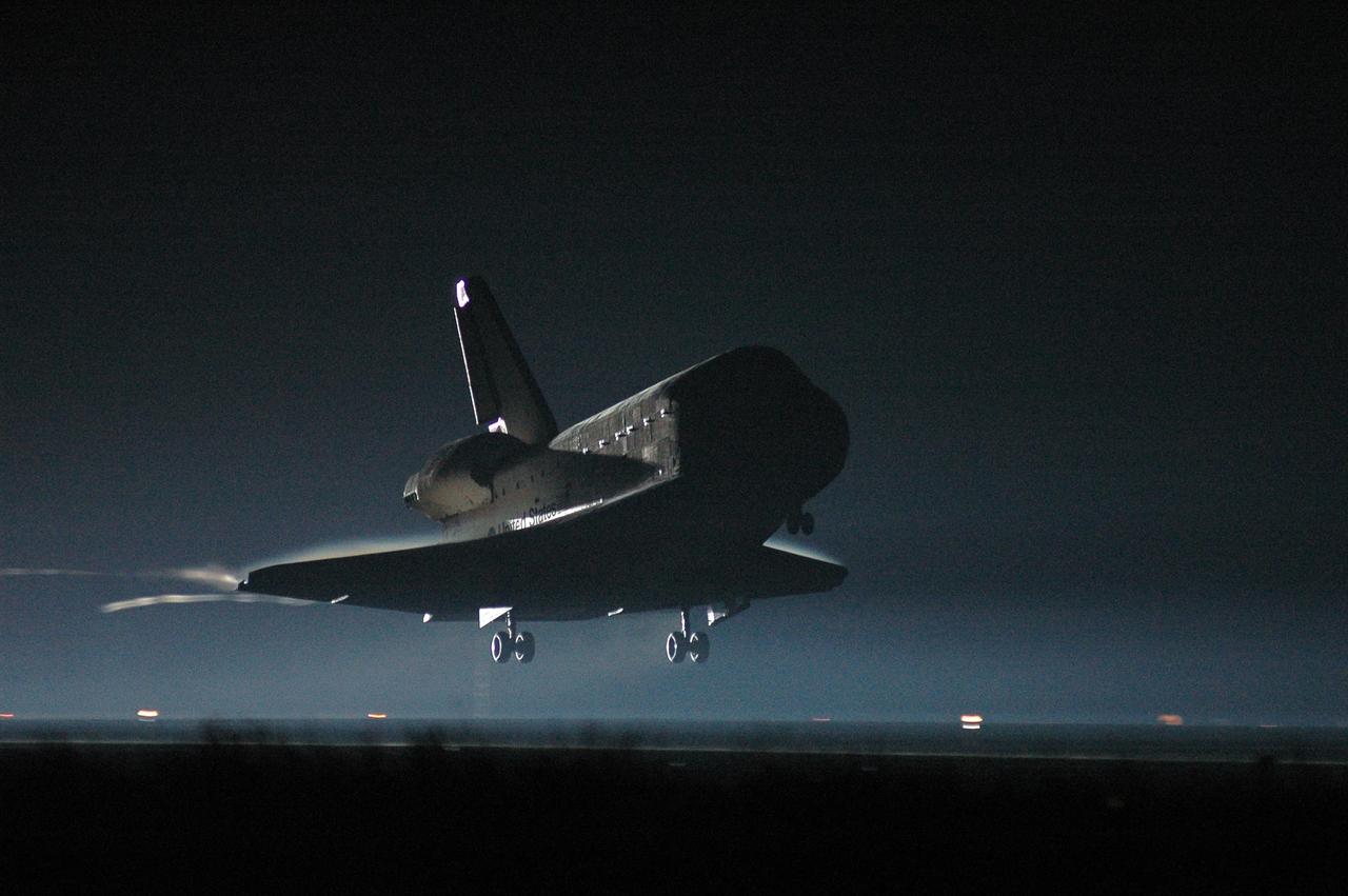 KENNEDY SPACE CENTER, FLA. -   Concluding mission STS-115, Atlantis and her crew return to Kennedy Space Center and approach a landing before sunrise on Runway 33.   Aboard are Commander Brent Jett, Pilot Christopher Ferguson, and Mission Specialists Joseph Tanner, David Burbank, Heidemarie Stefanyshyn-Piper and Steven MacLean, who represents the Canadian Space Agency.  During the mission, Tanner, McLean, Burbank and Piper completed three spacewalks to attach the P3/P4 integrated truss structure to the International Space Station.  Main gear touchdown was at 6:21:30 a.m. EDT.  Nose gear touchdown was at 6:21:36 a.m. and wheel stop was at 6:22:16 a.m.  At touchdown -- nominally about 2,500 ft. beyond the runway threshold -- the orbiter is traveling at a speed ranging from 213 to 226 mph. Atlantis traveled 4.9 million miles, landing on orbit 187. Mission elapsed time was 11 days, 19 hours, six minutes This is the 15th night landing at KSC and the 23rd night landing overall.  Photo credit: NASA/Kim Shiflett